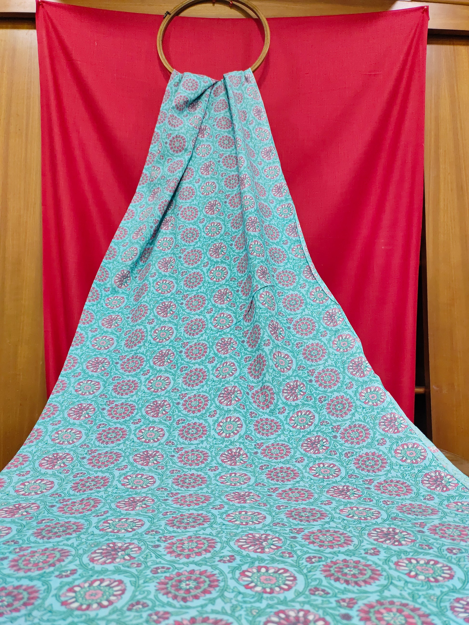 Pink cool floral print on blue fabric