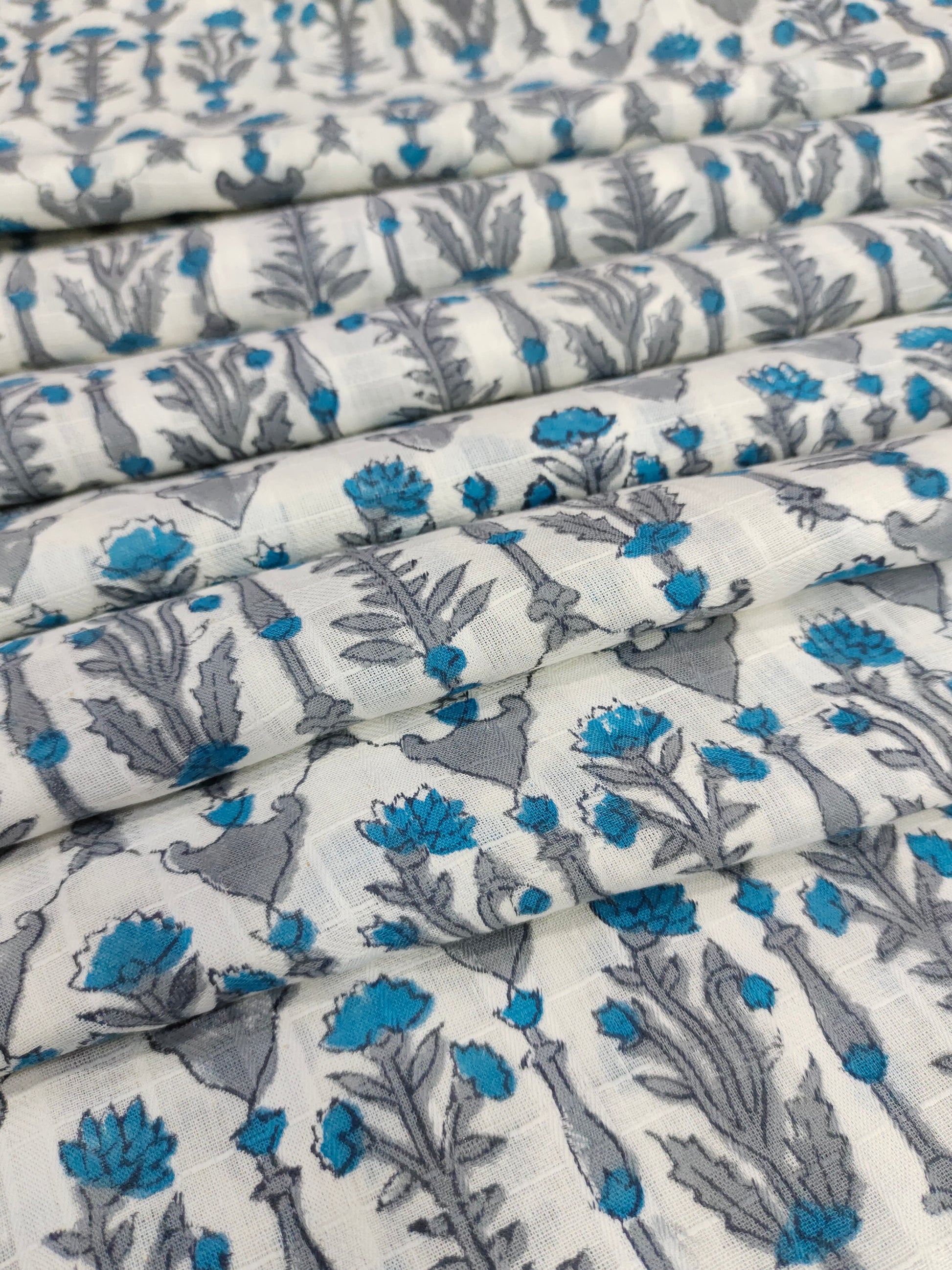 Handblock print with blue and grey on white soft cotton fabric