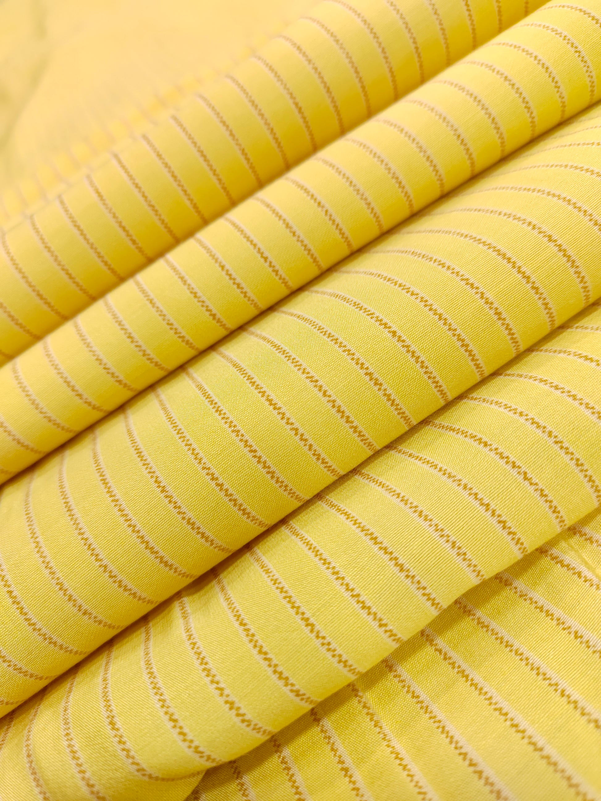 Light lemon muslin fabric with grey stripes