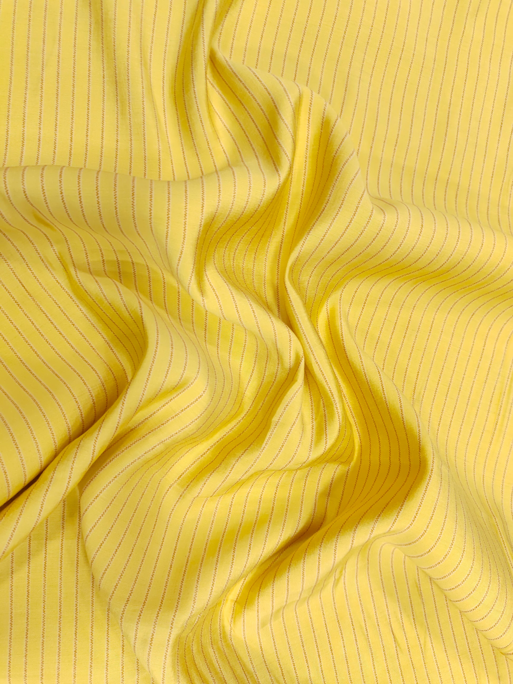 Light lemon muslin fabric with grey stripes