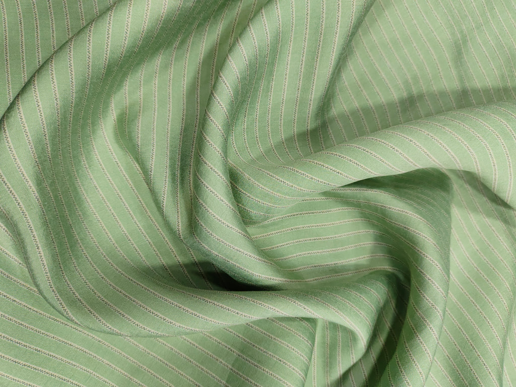 Sea green muslin fabric with beige stripes