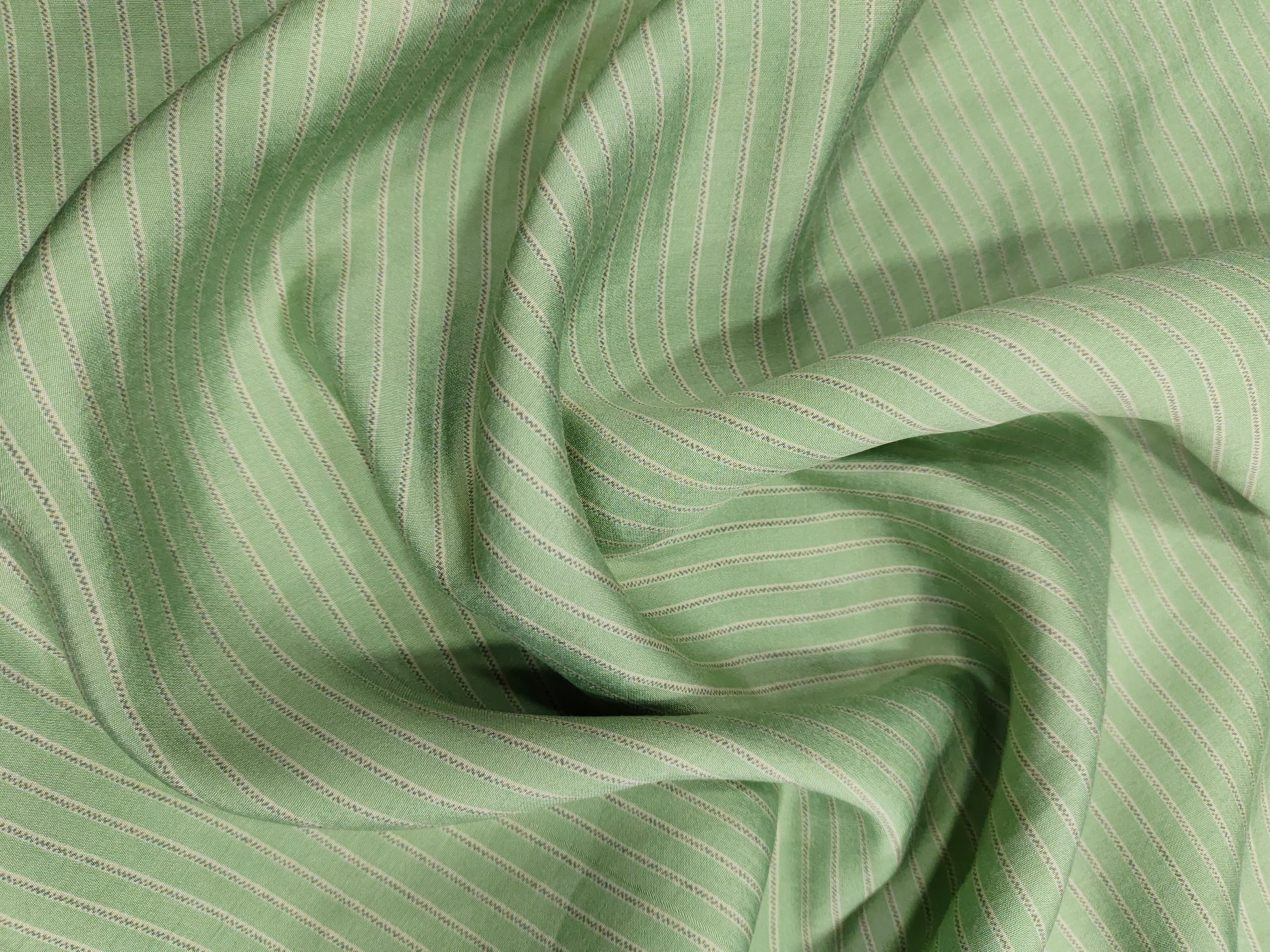 Sea green muslin fabric with beige stripes