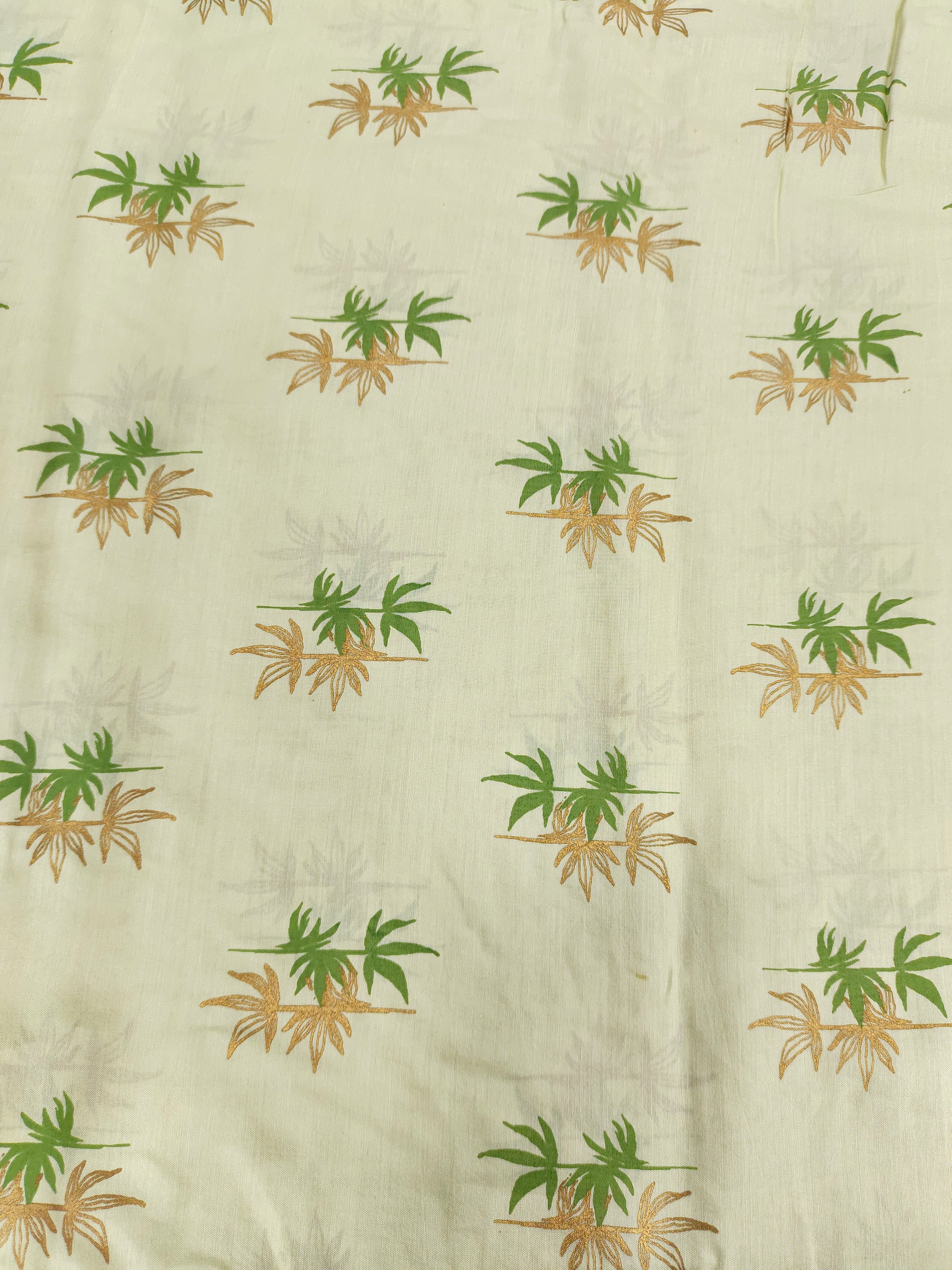 Light green cotton silk fabric with green and gold print