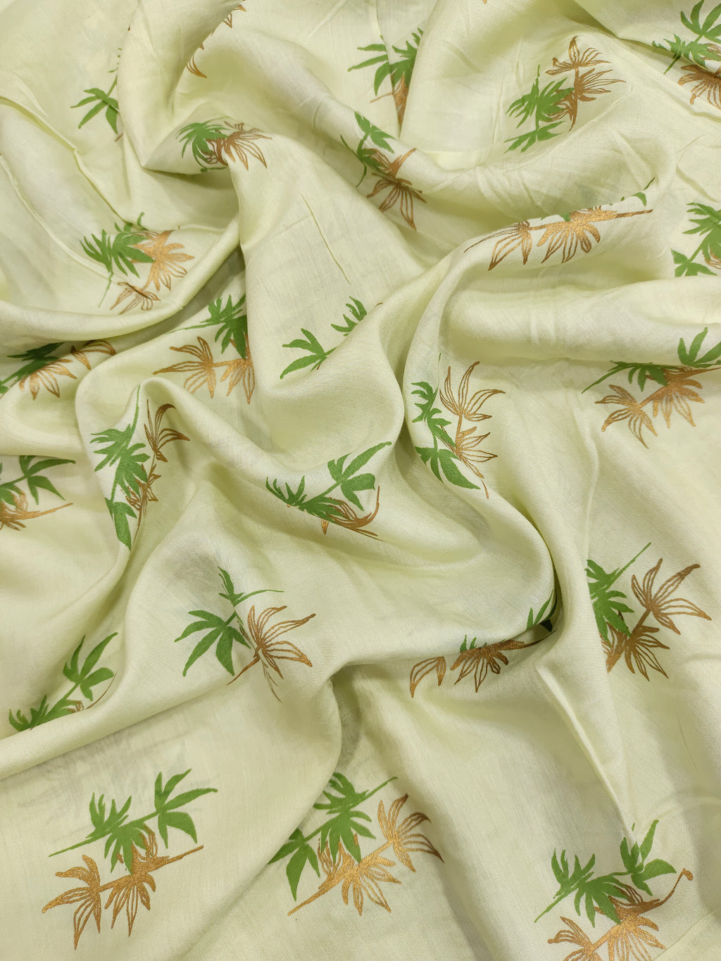Light green cotton silk fabric with green and gold print