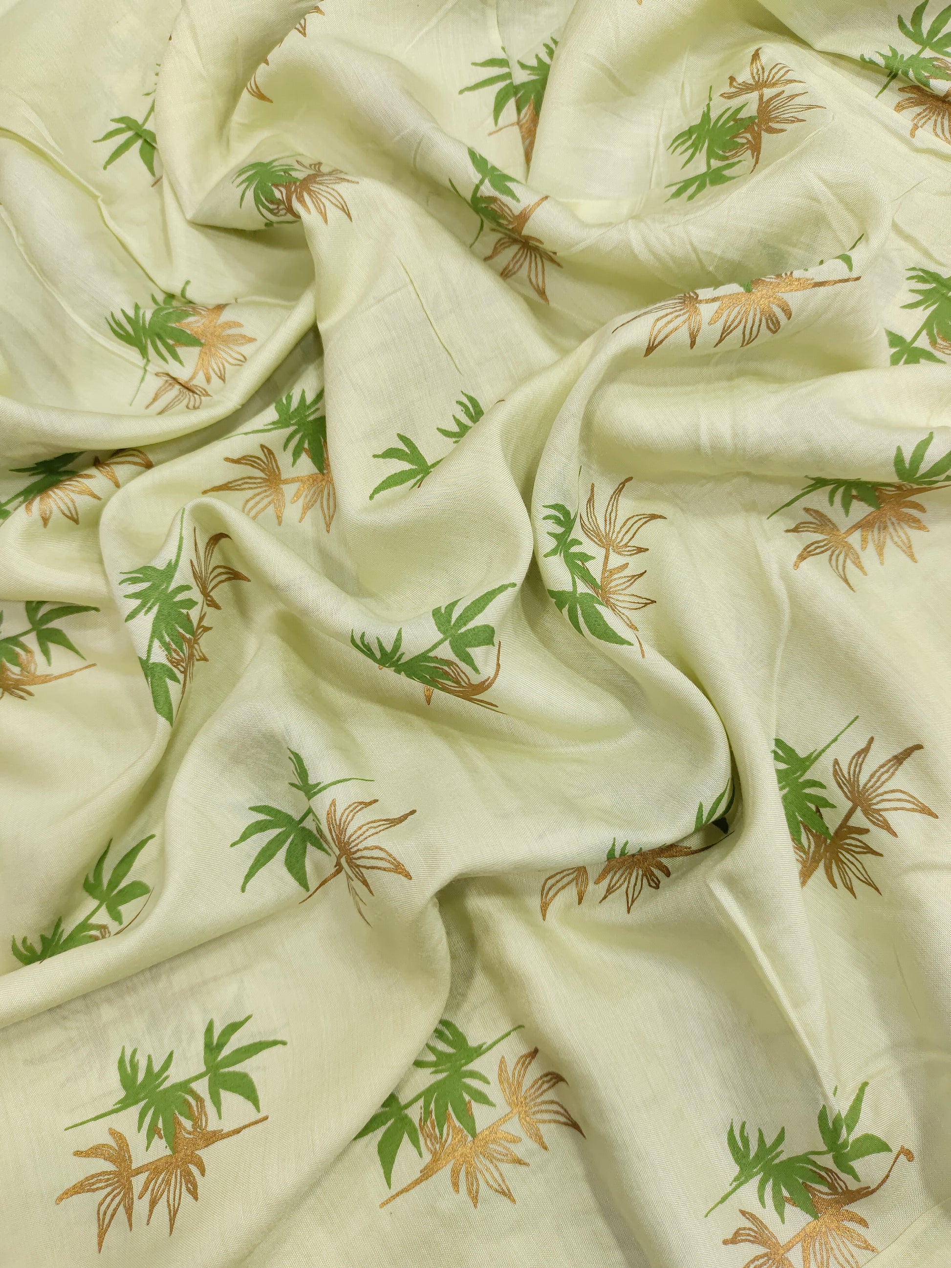 Light green cotton silk fabric with green and gold print