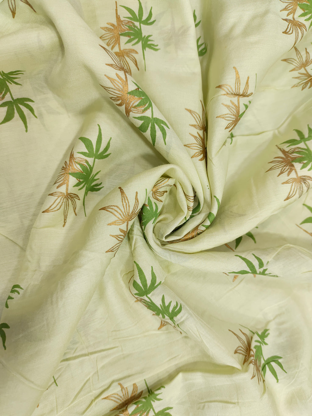 Light green cotton silk fabric with green and gold print