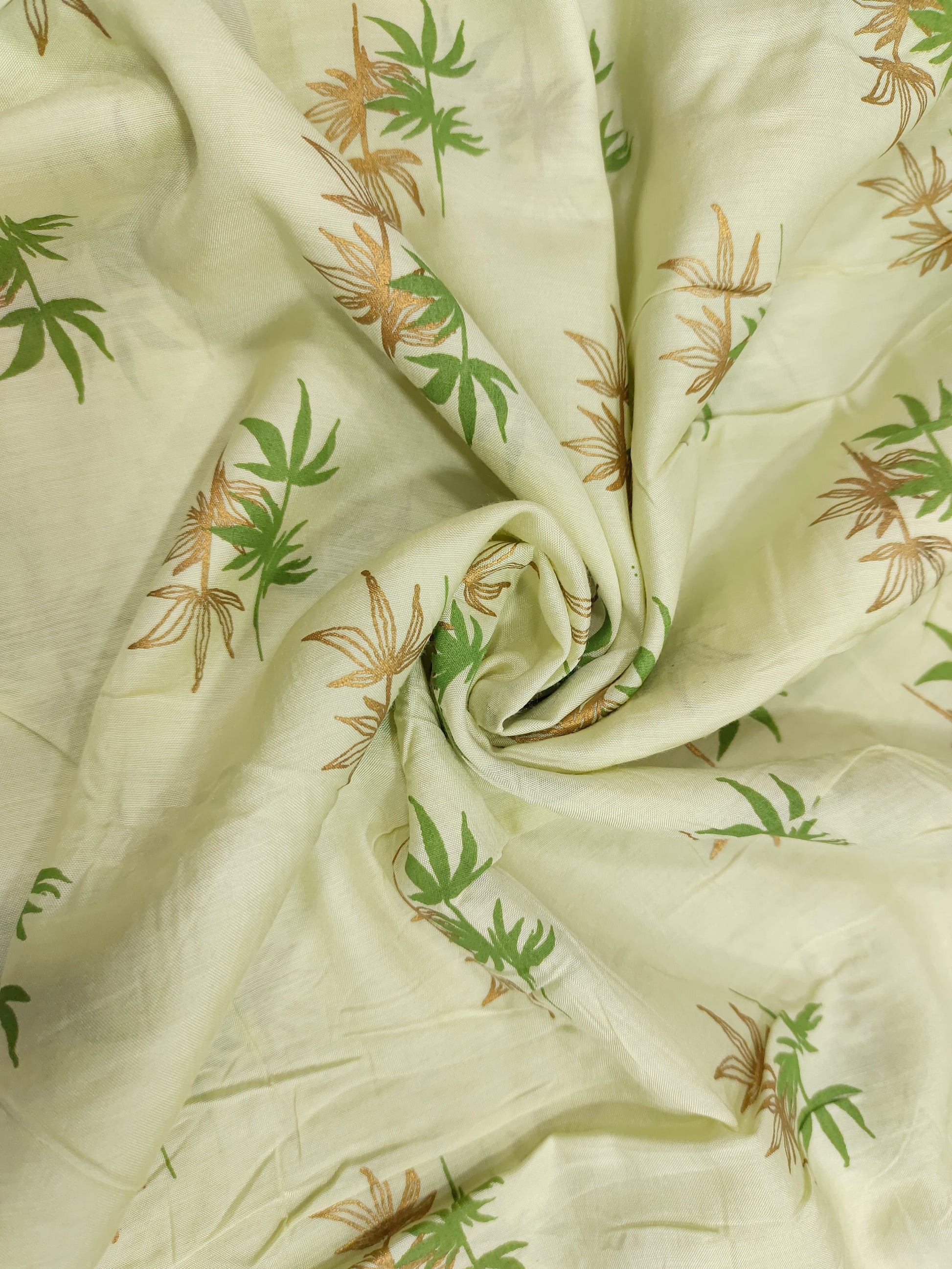 Light green cotton silk fabric with green and gold print