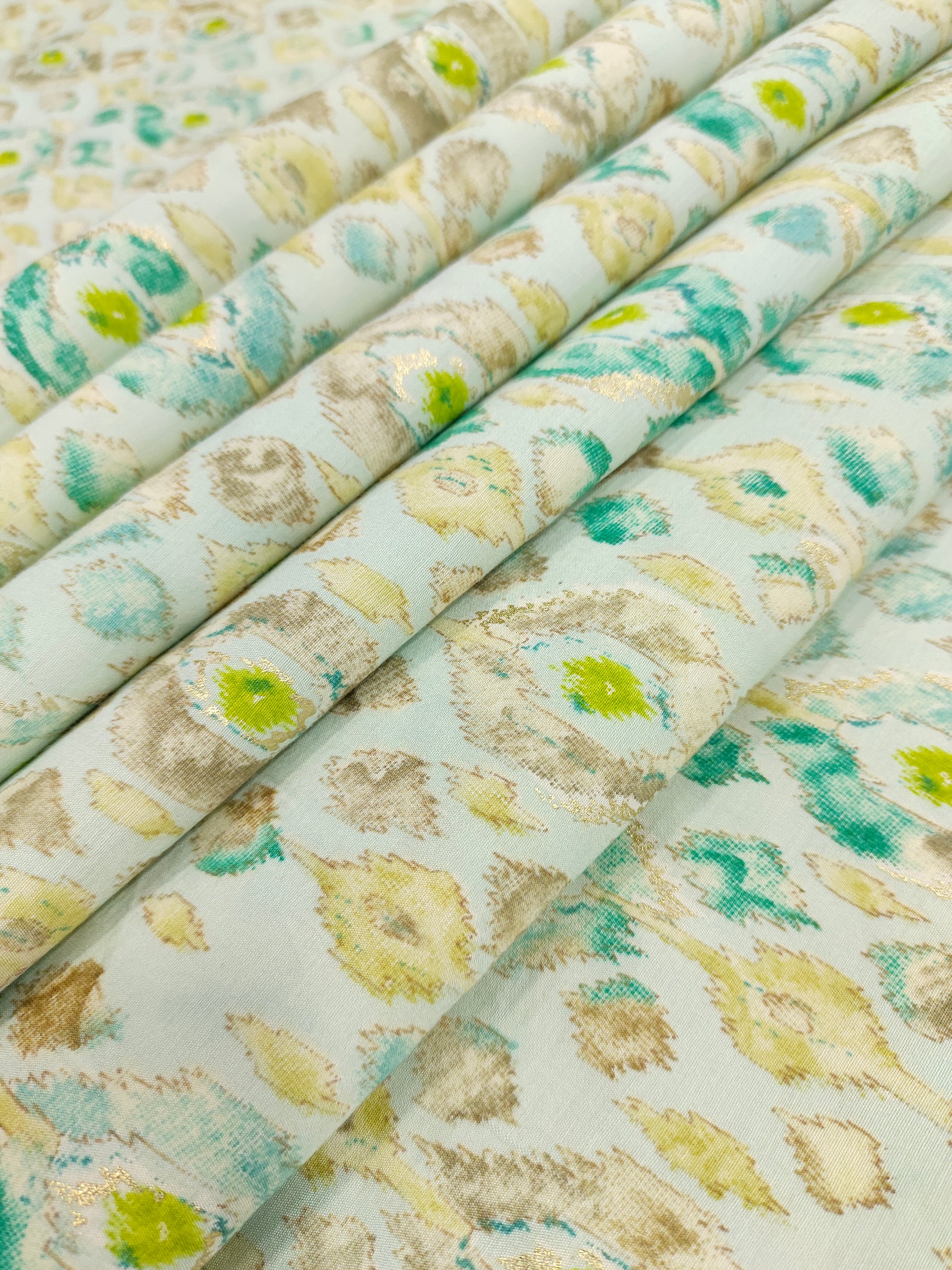 Offwhite muslin fabric with blue and gold digital print