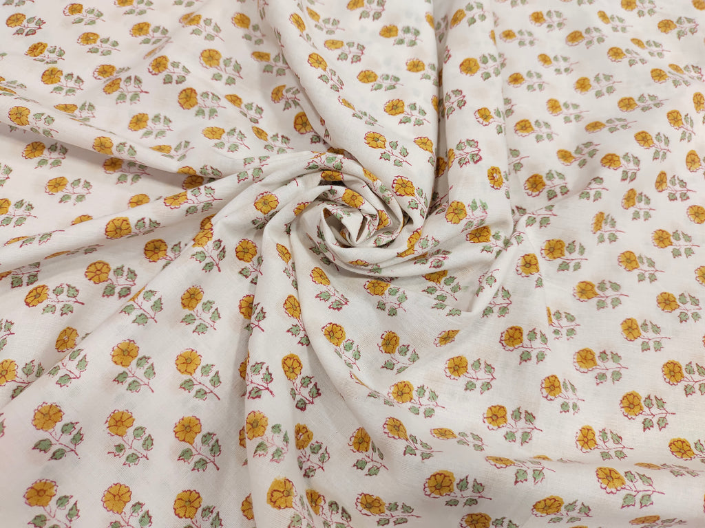 White cotton fabric with mustard and green handblock print
