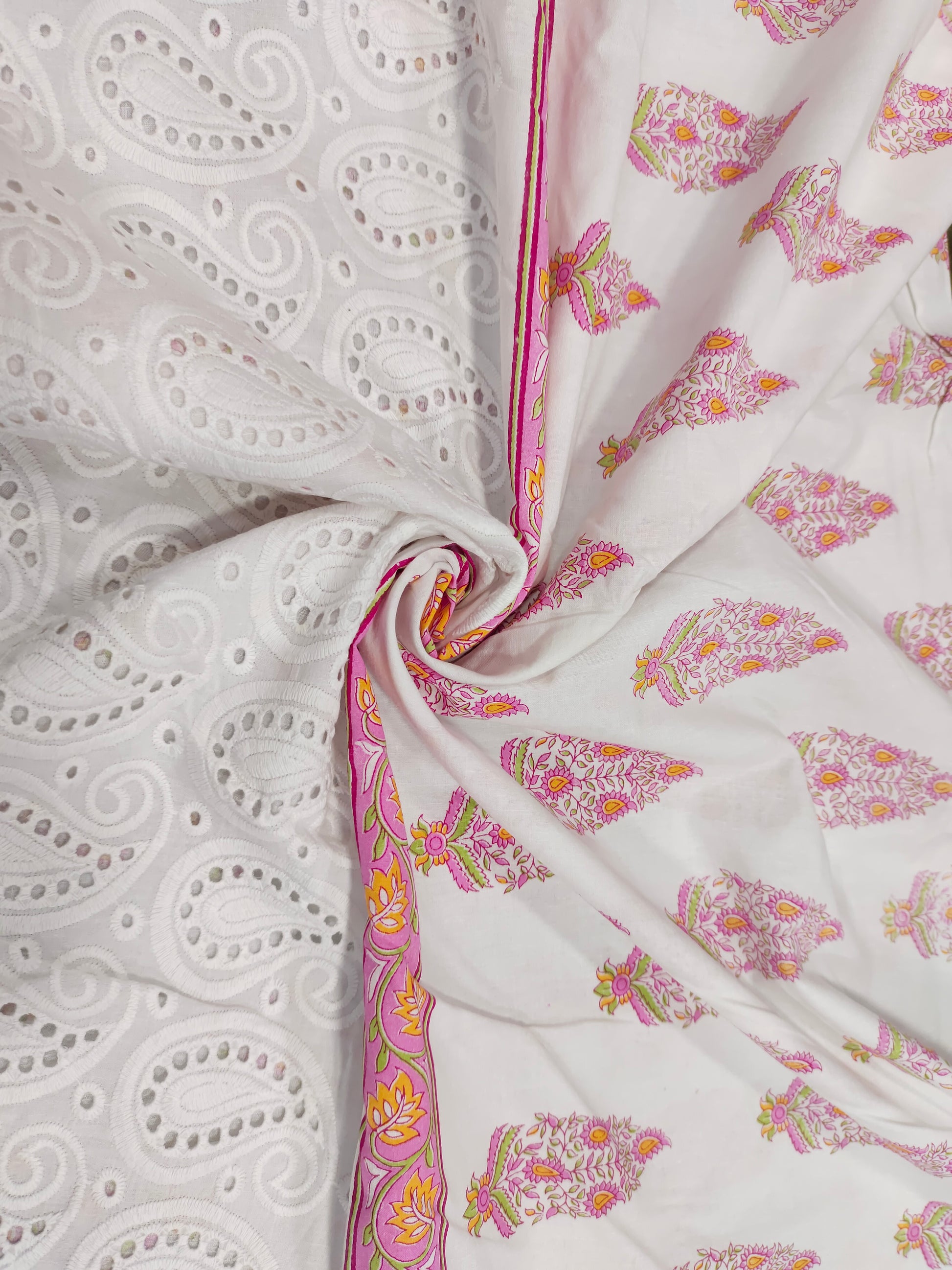 White daman cutwork embroidered fabric with pink print