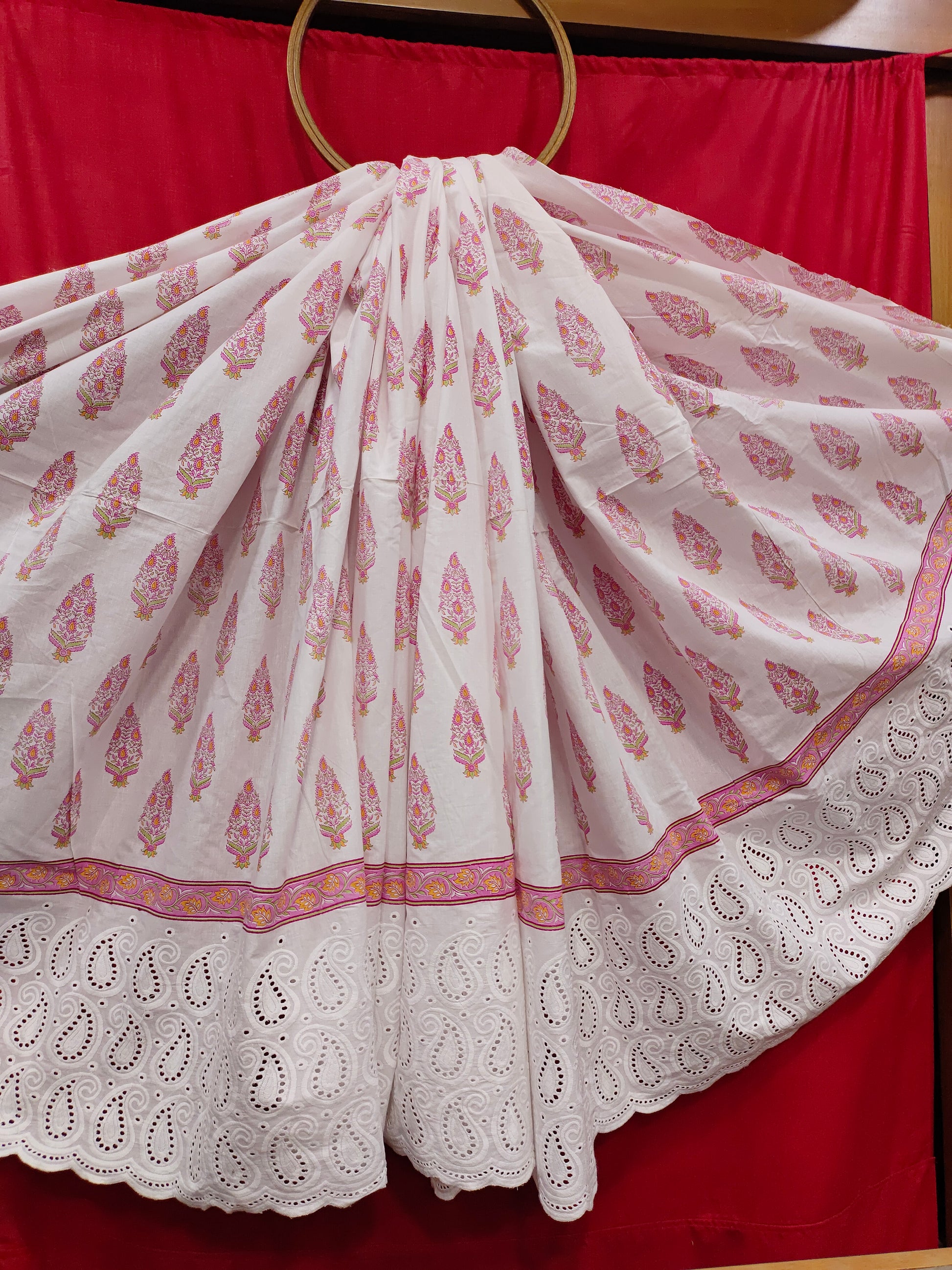 White daman cutwork embroidered fabric with pink print