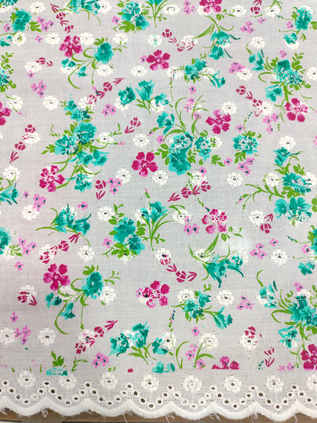 Offwhite embroidered fabric with green and pink print
