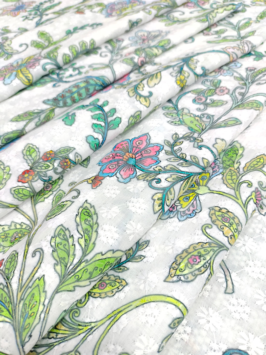 White embroidered fabric digital print with blue pink and green