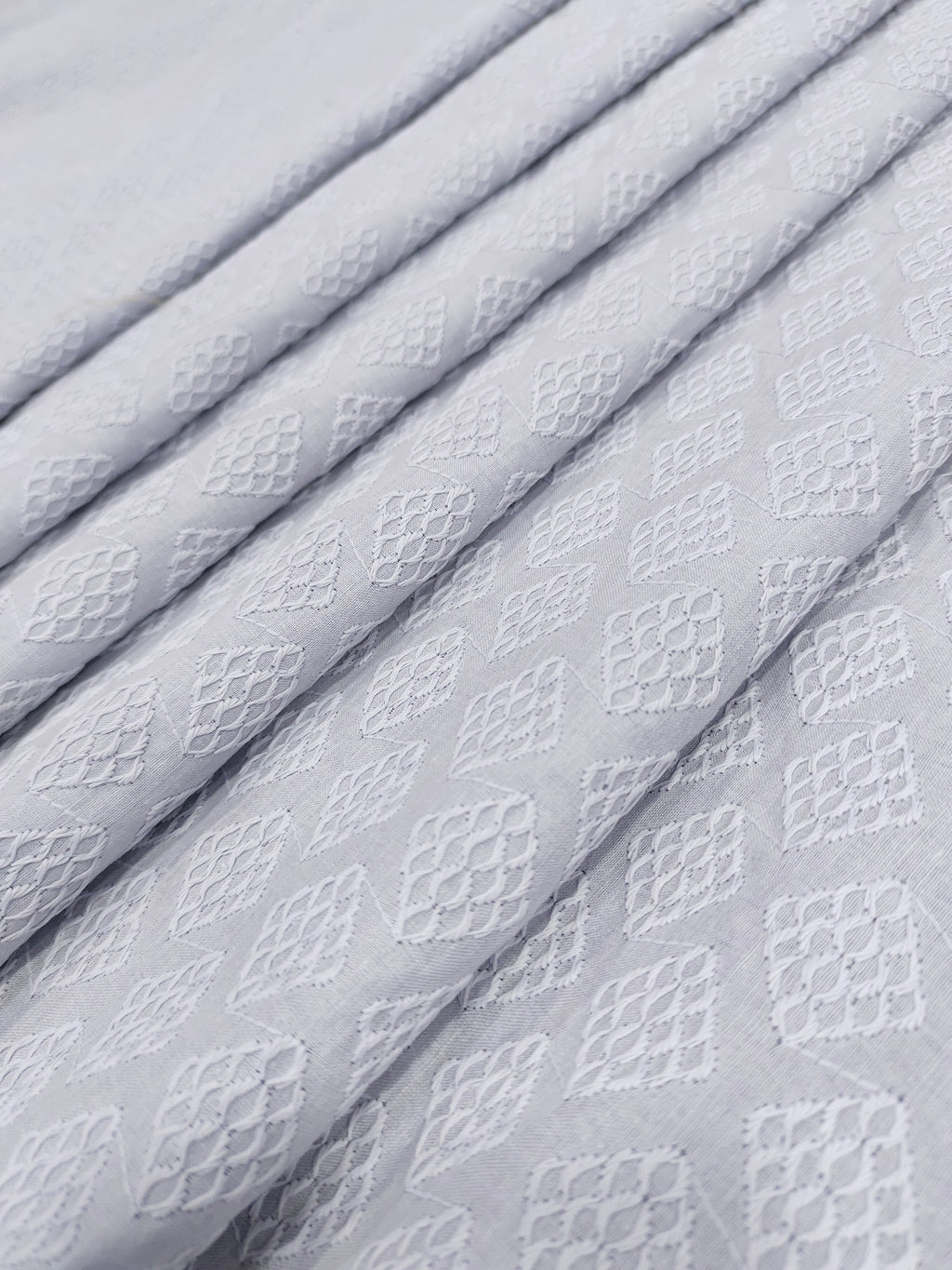 Grey embroidered fabric