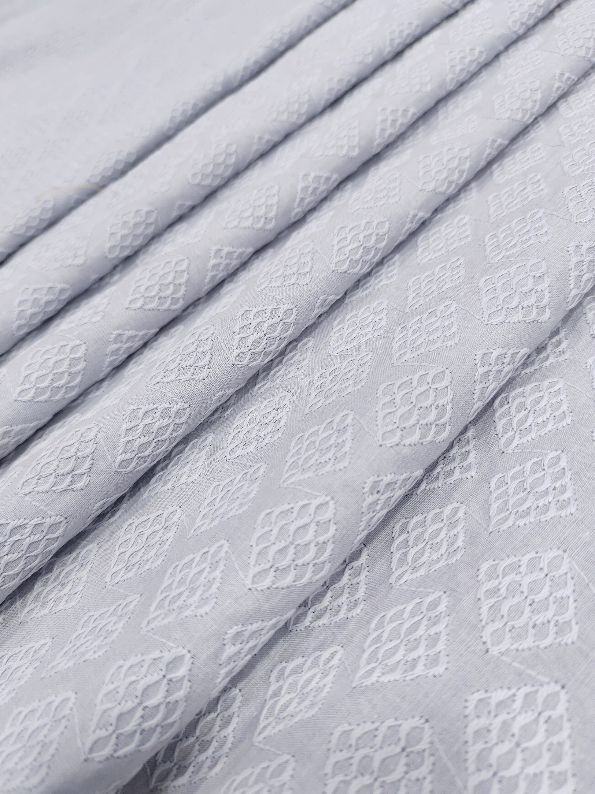 Grey embroidered fabric