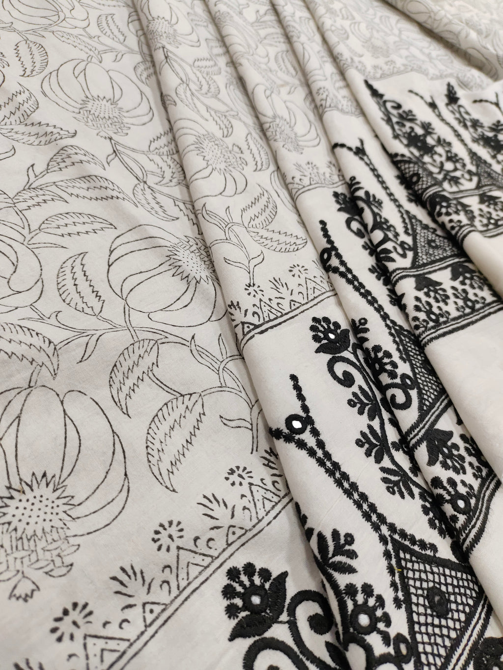 White fabric with black  handblock print and added with schiffli daman