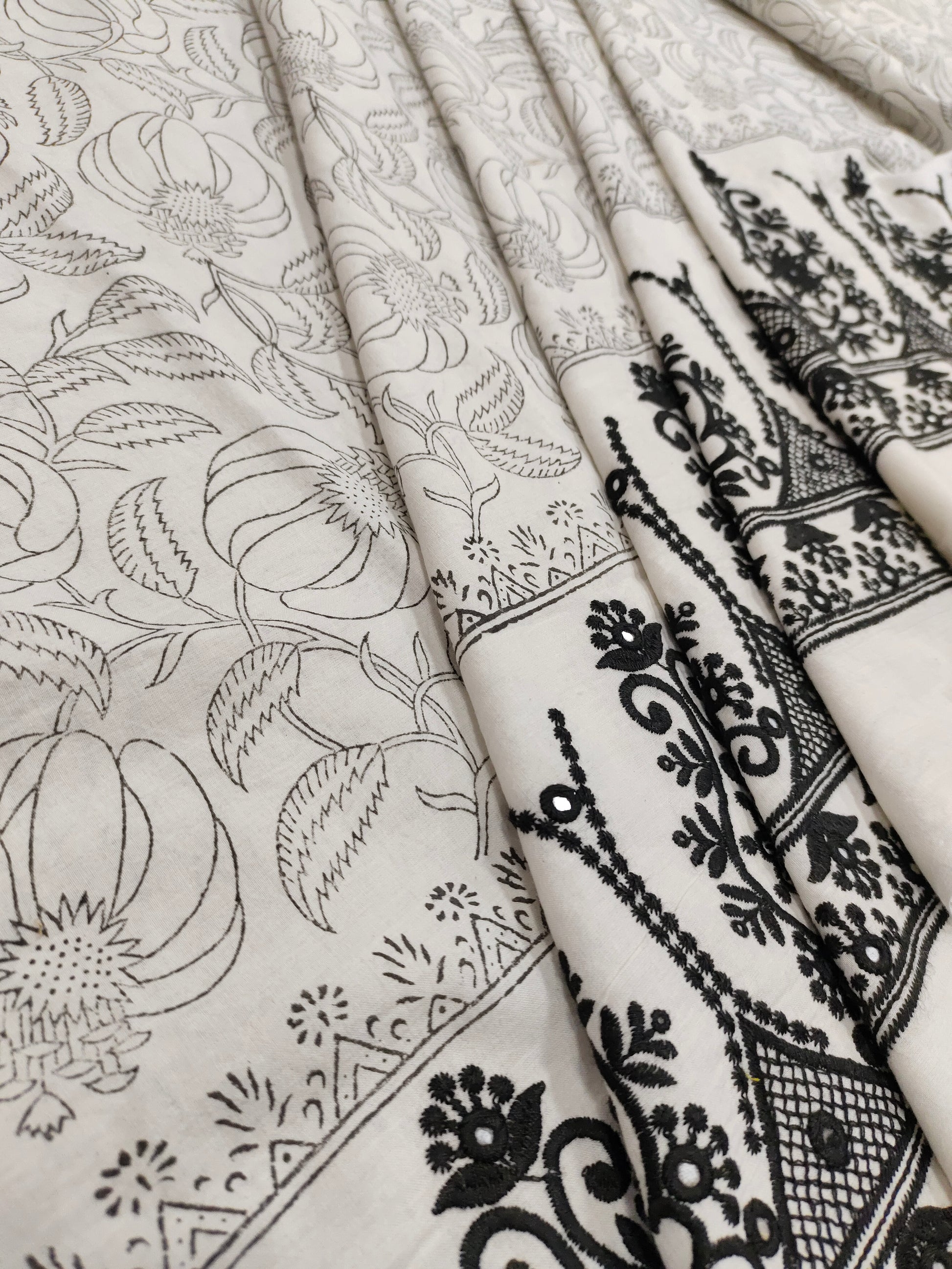 White fabric with black  handblock print and added with schiffli daman
