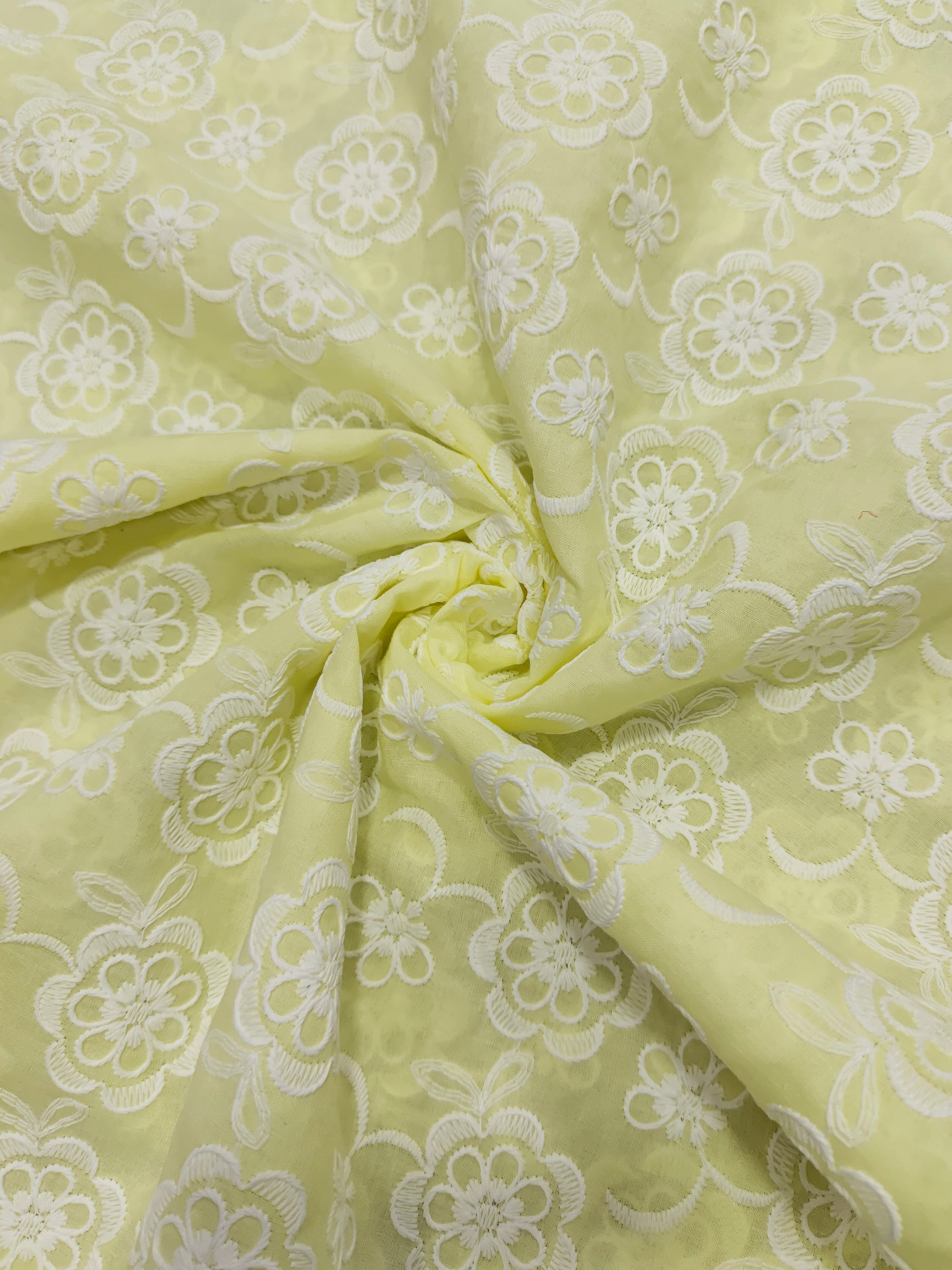 Light lemon embroidered fabric