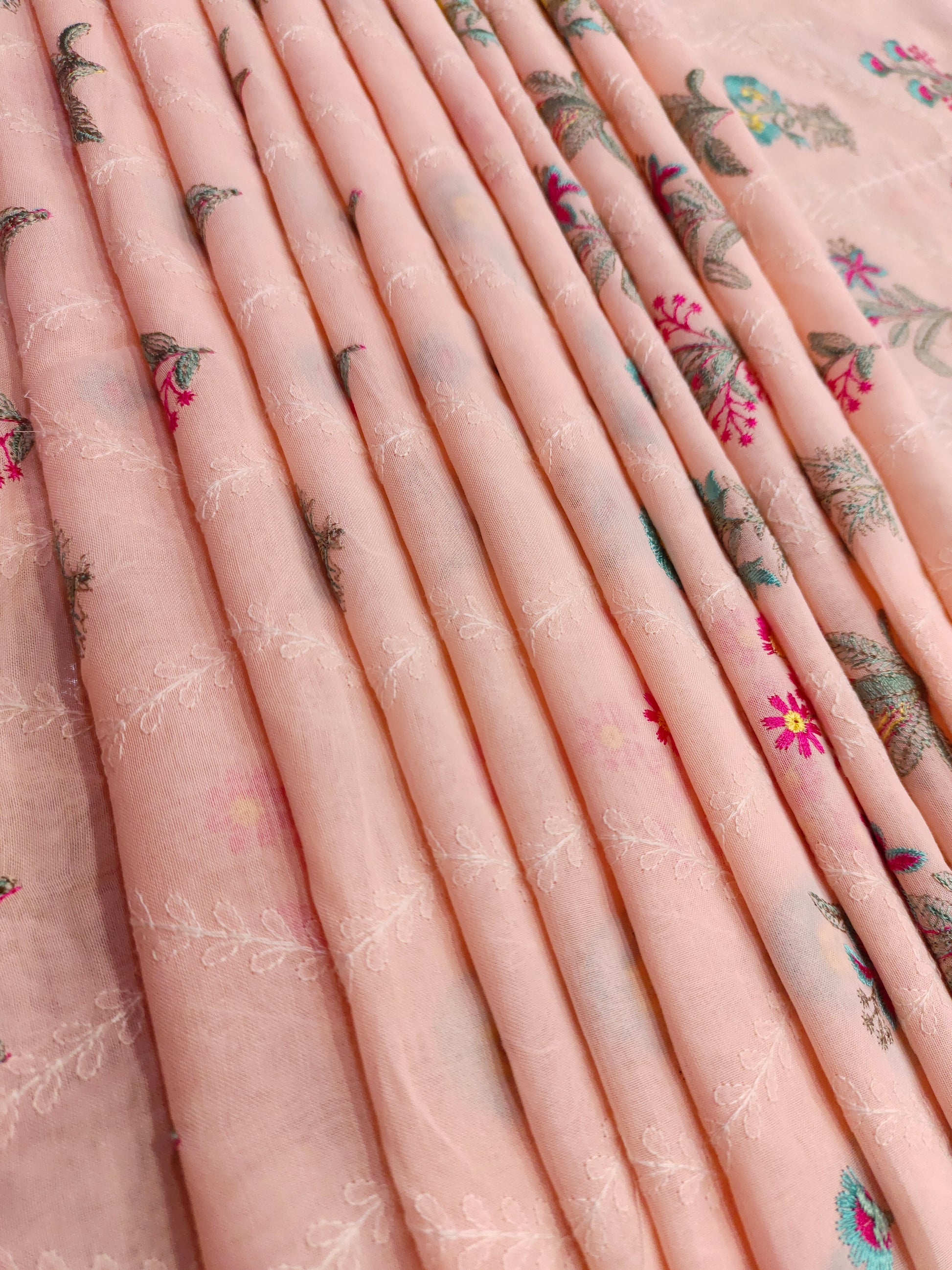 light peach floral embroidery  with blue and pink on voile fabric