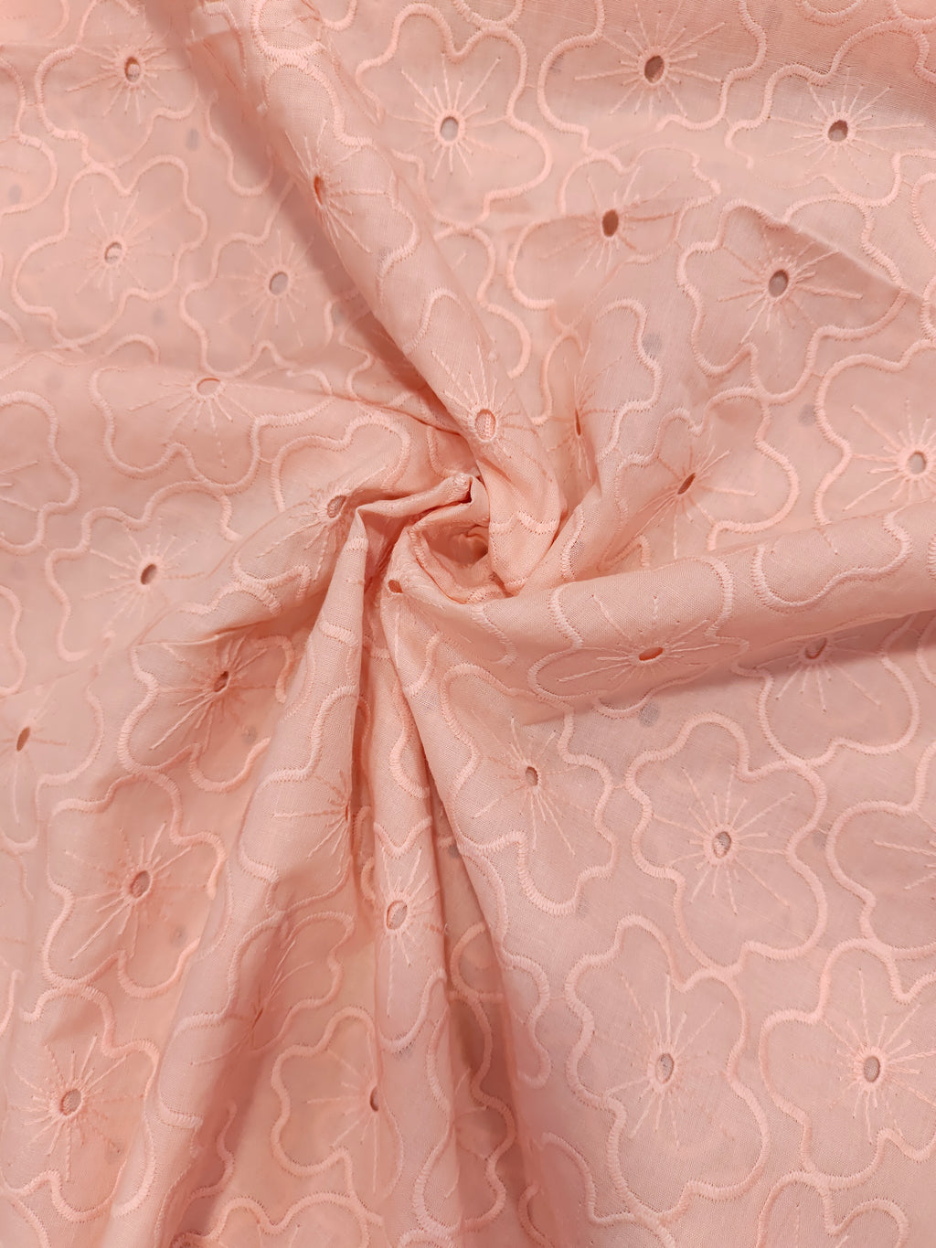 Peach cotton embroidery with small holes cut work