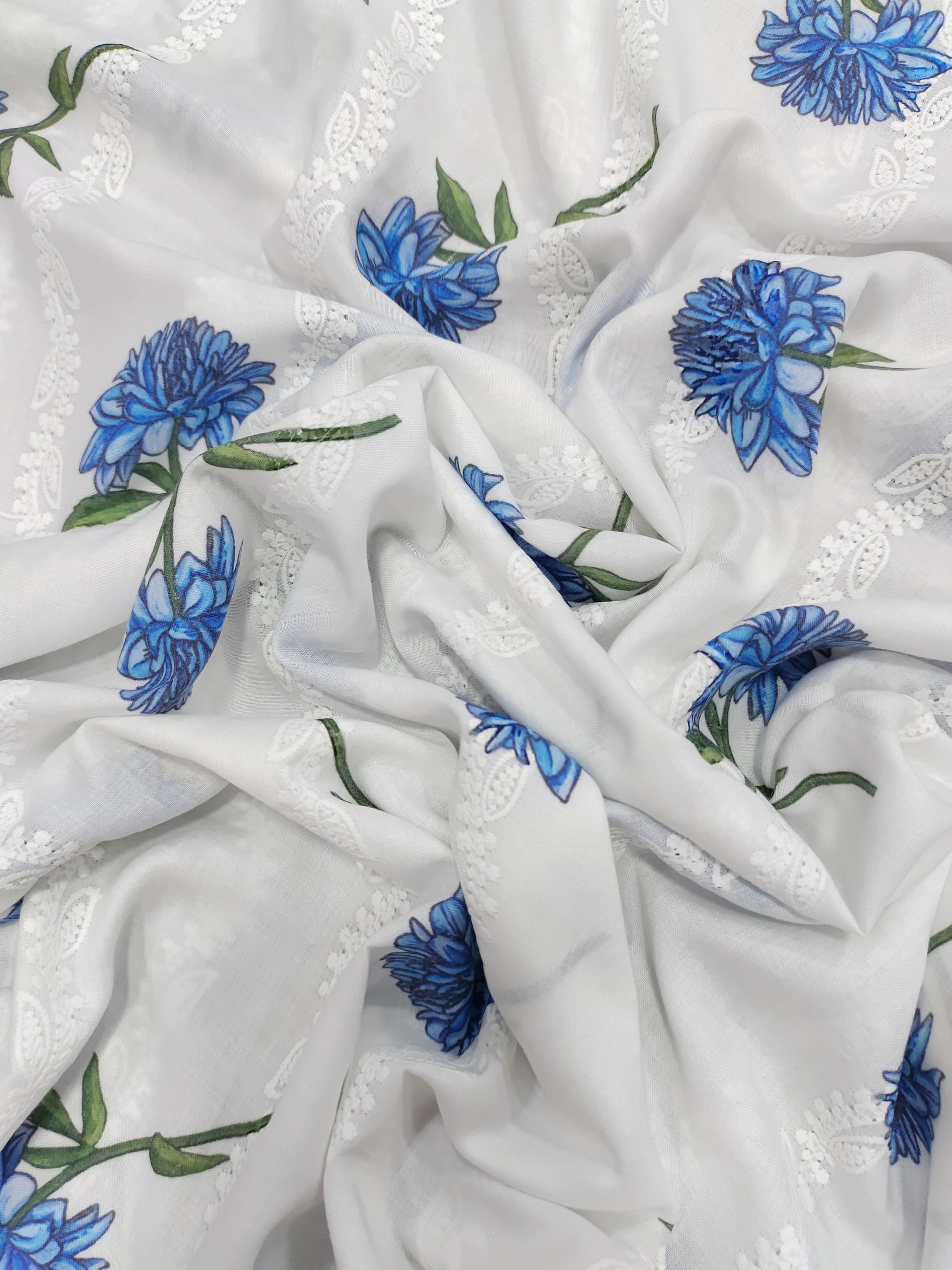 White embroidered with blue flowers