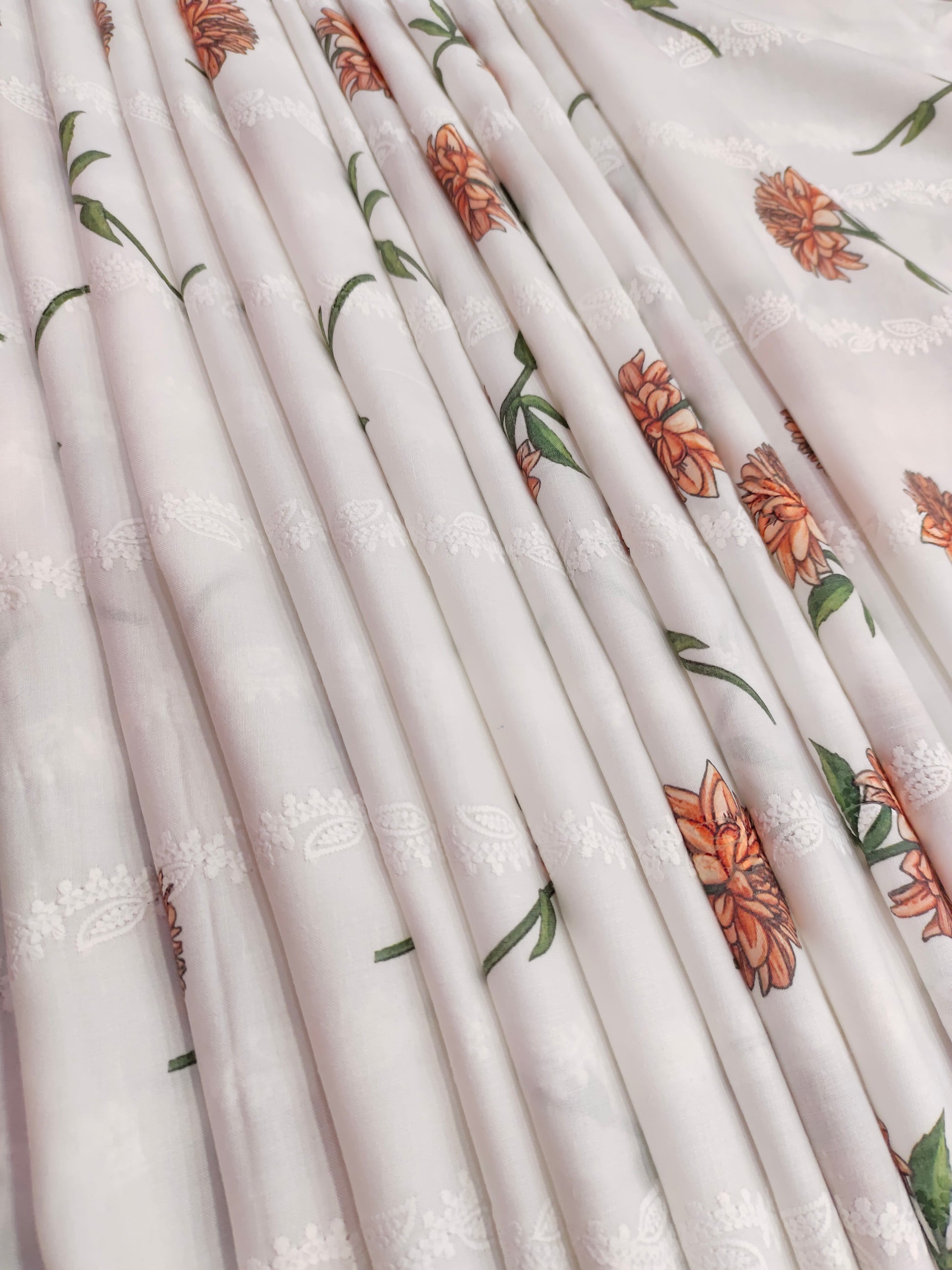 White embroidered with orange flowers