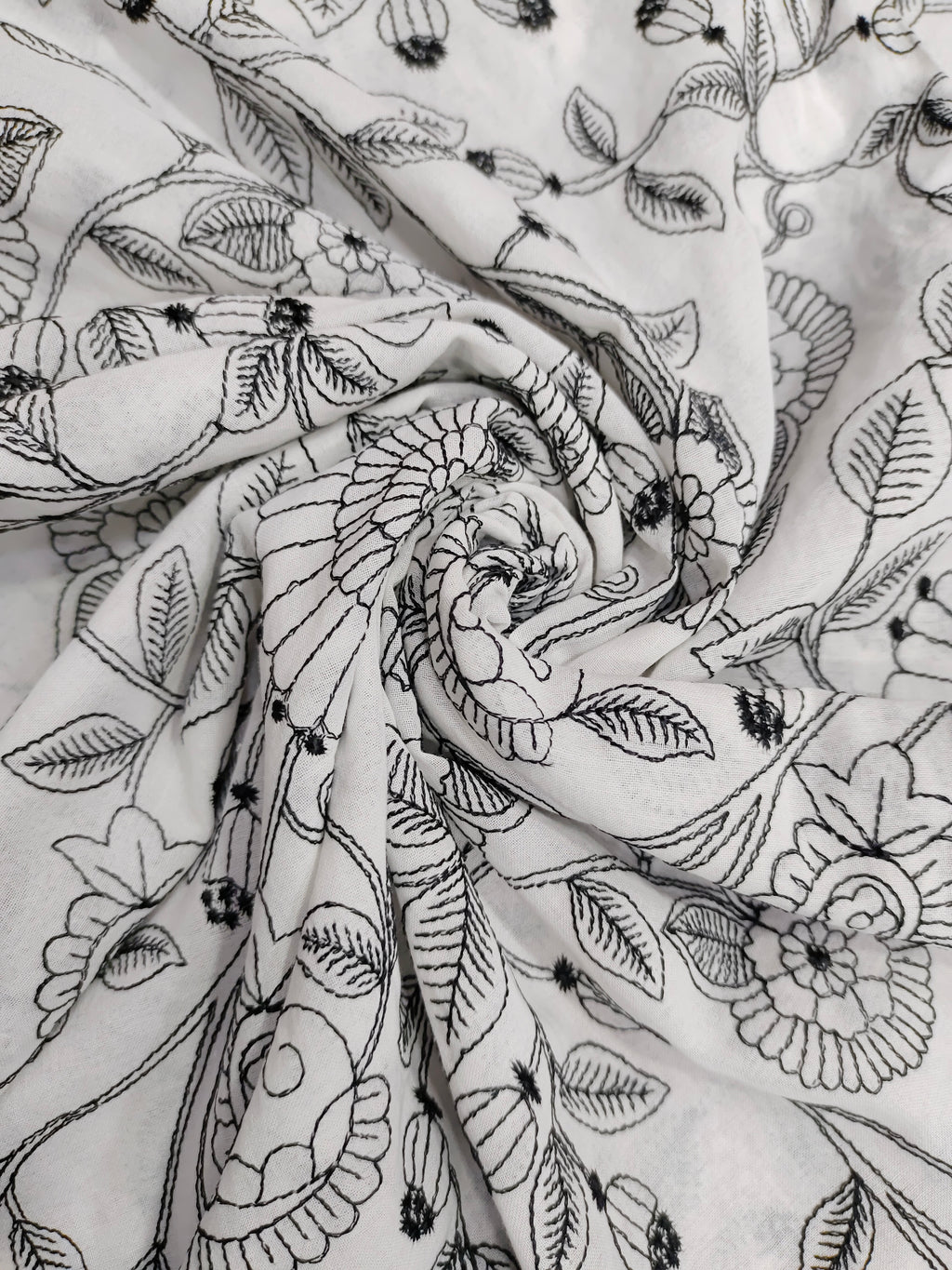 Voile fabric with black embroidery