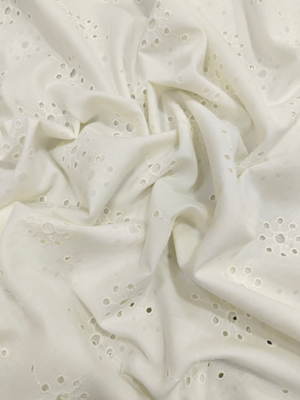 White embroidered cut work fabric