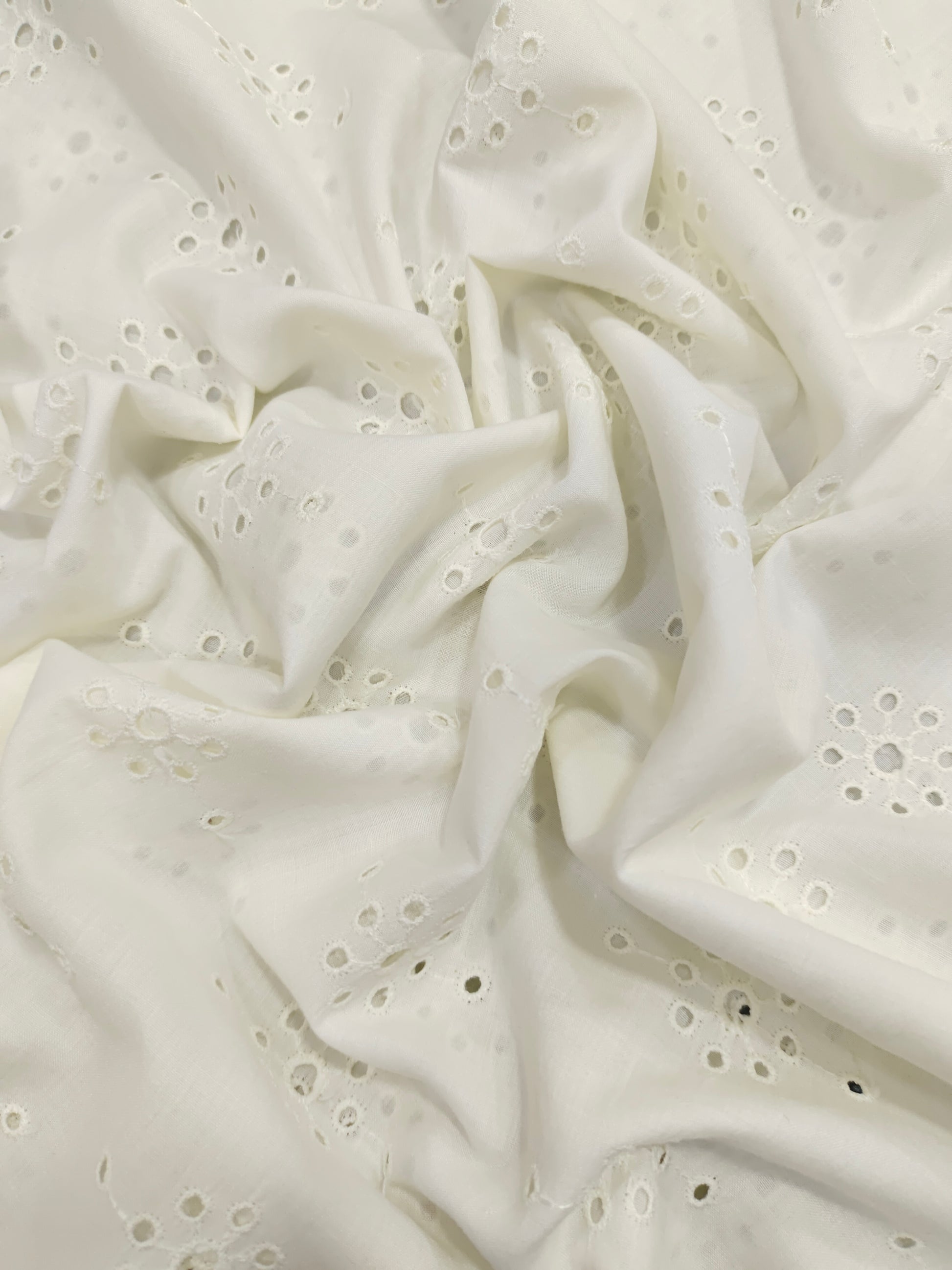 White embroidered cut work fabric