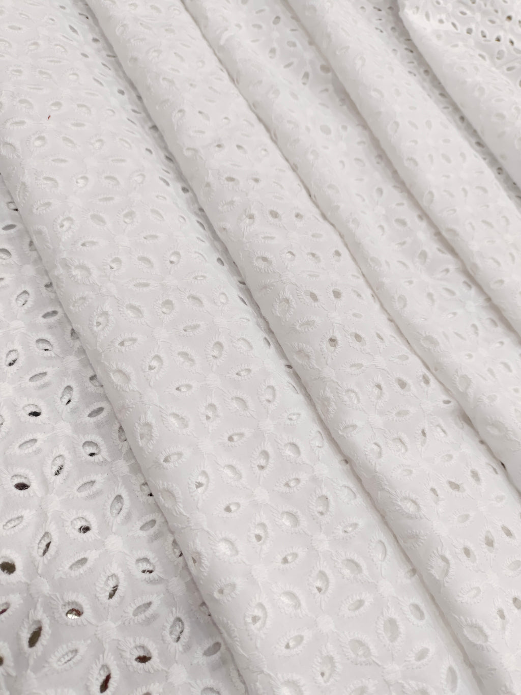 White embroidered cut work fabric