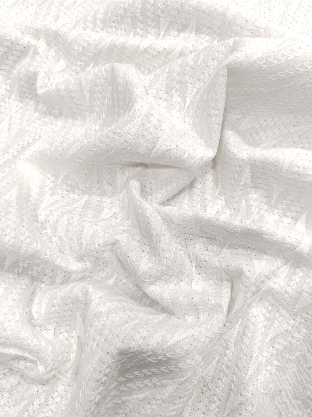 White cotton embroidered fabric