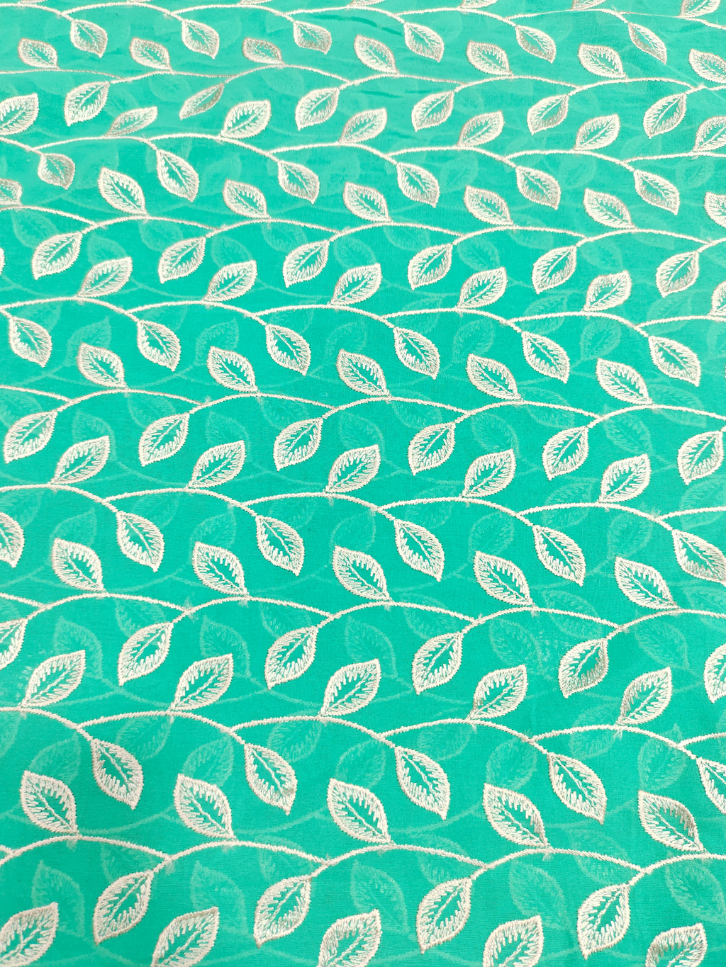 Voile embroidered fabric with beige leaves work