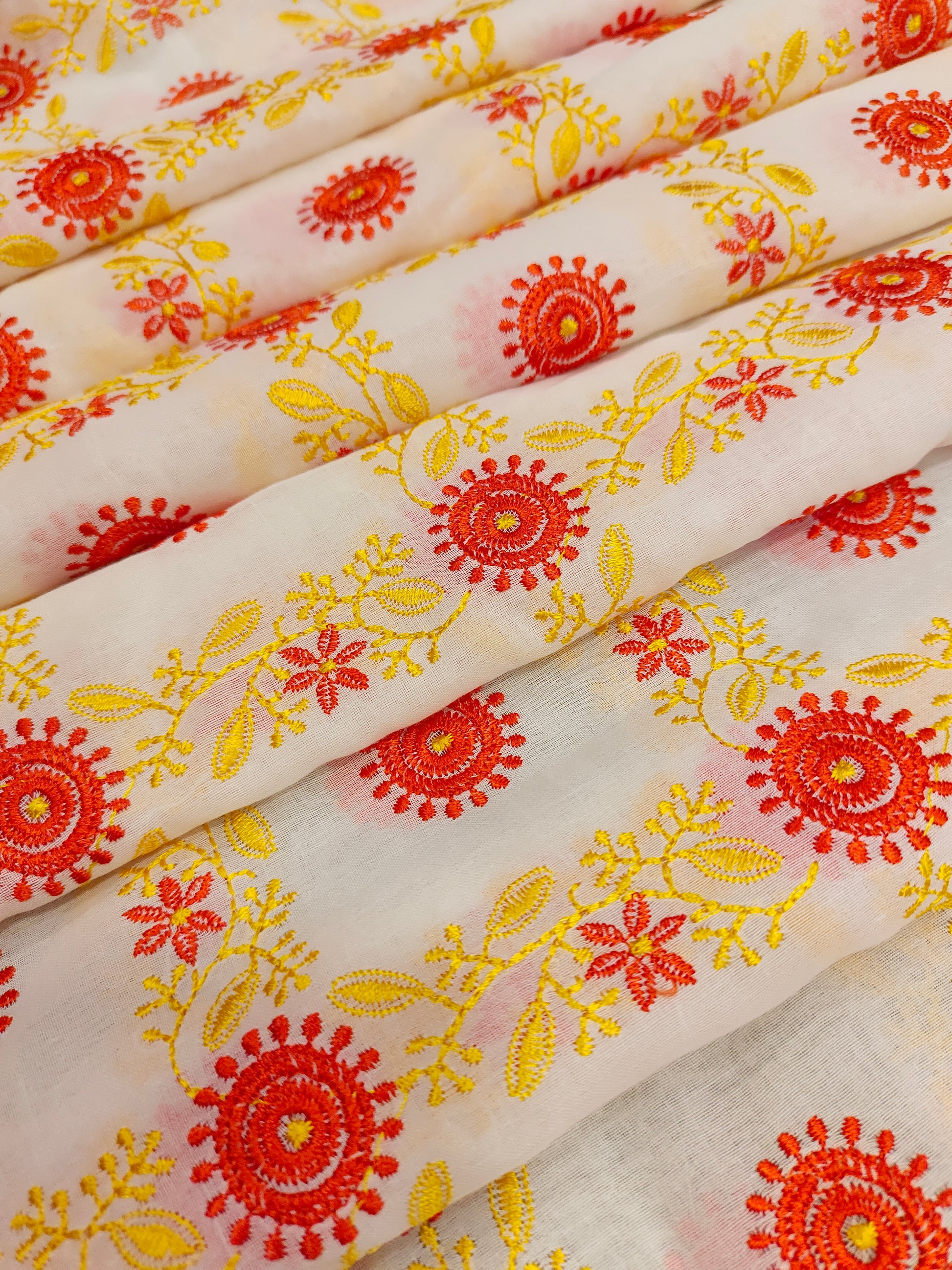 Voile yellow and orange embroidered fabric