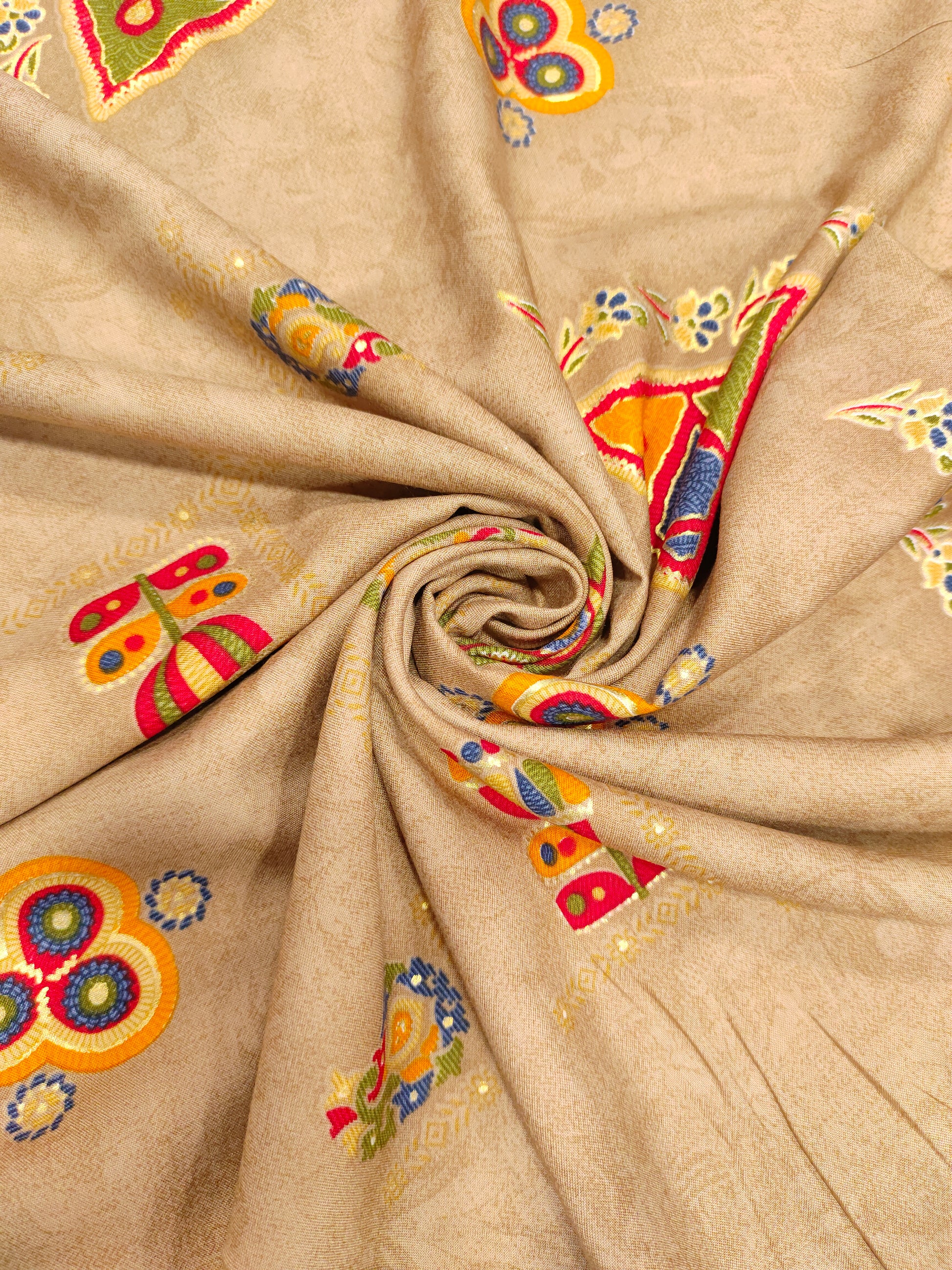 Rayon fabric beige base with different motifs in multicolour
