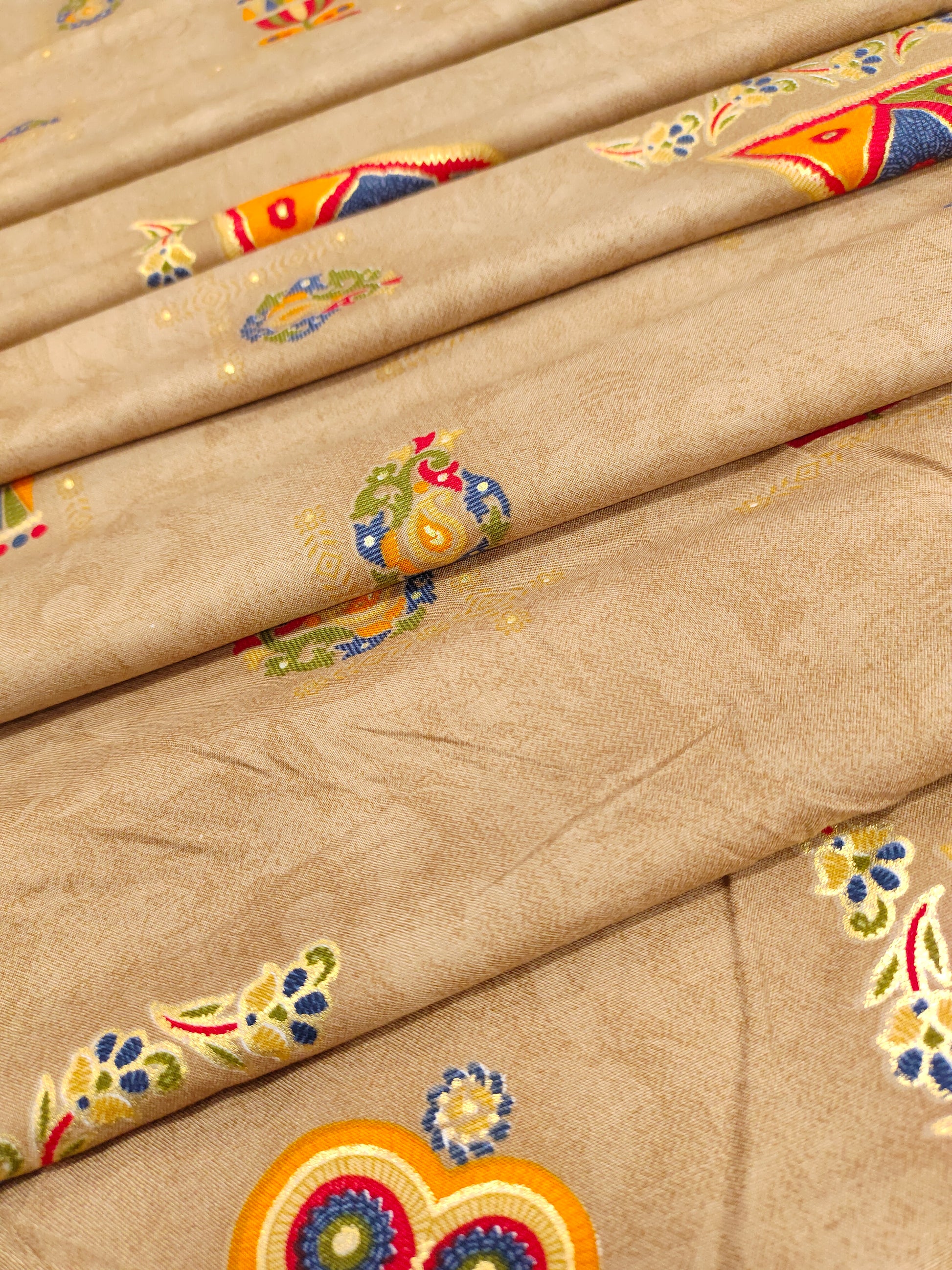 Rayon fabric beige base with different motifs in multicolour