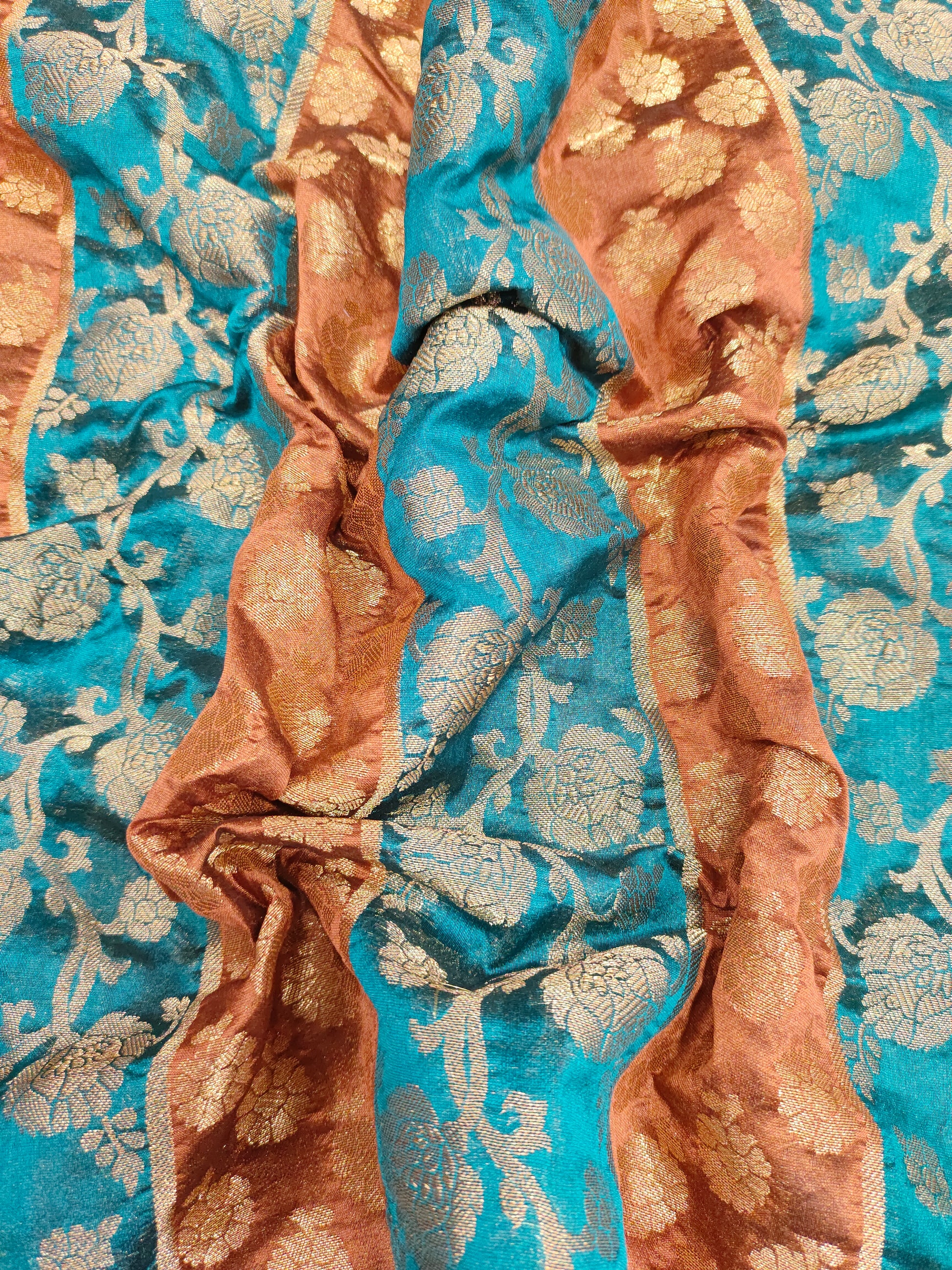 Banarasi stripe fabric with peacock blue and brown with rust weave