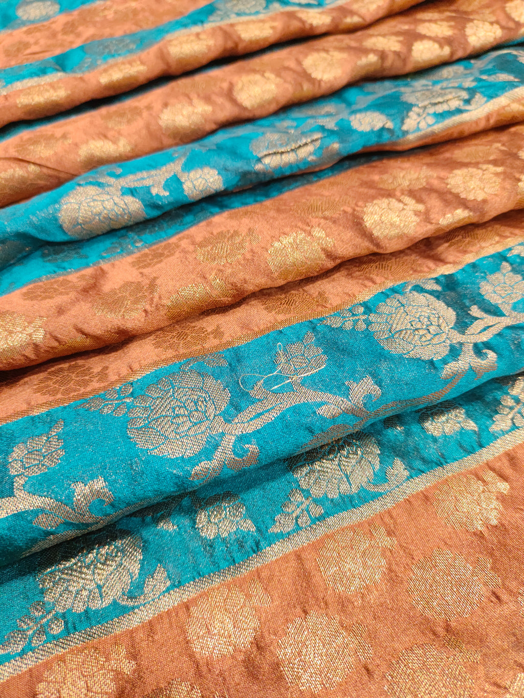 Banarasi stripe fabric with peacock blue and brown with rust weave
