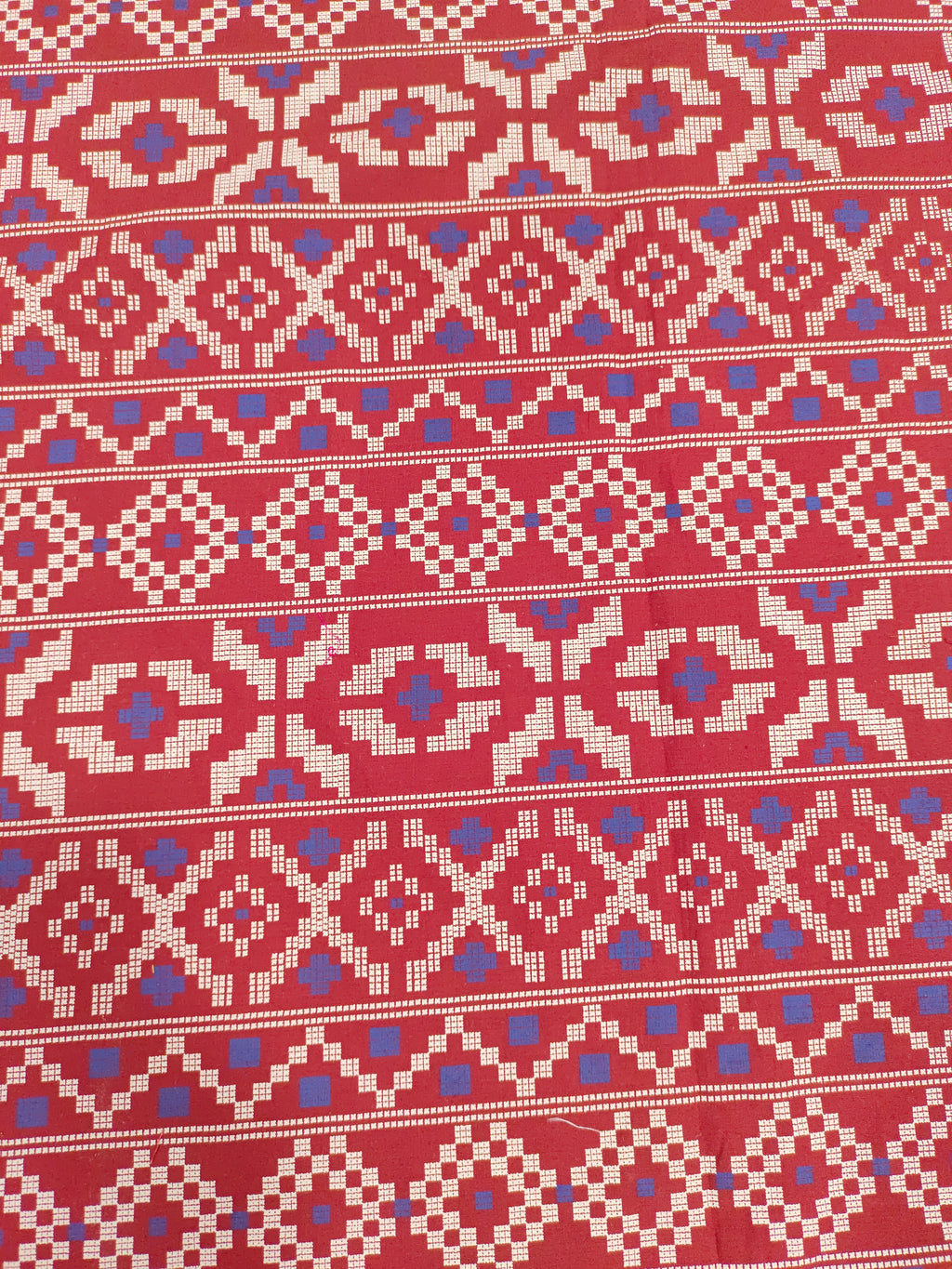 Maroon cotton fabric with blue and off white print