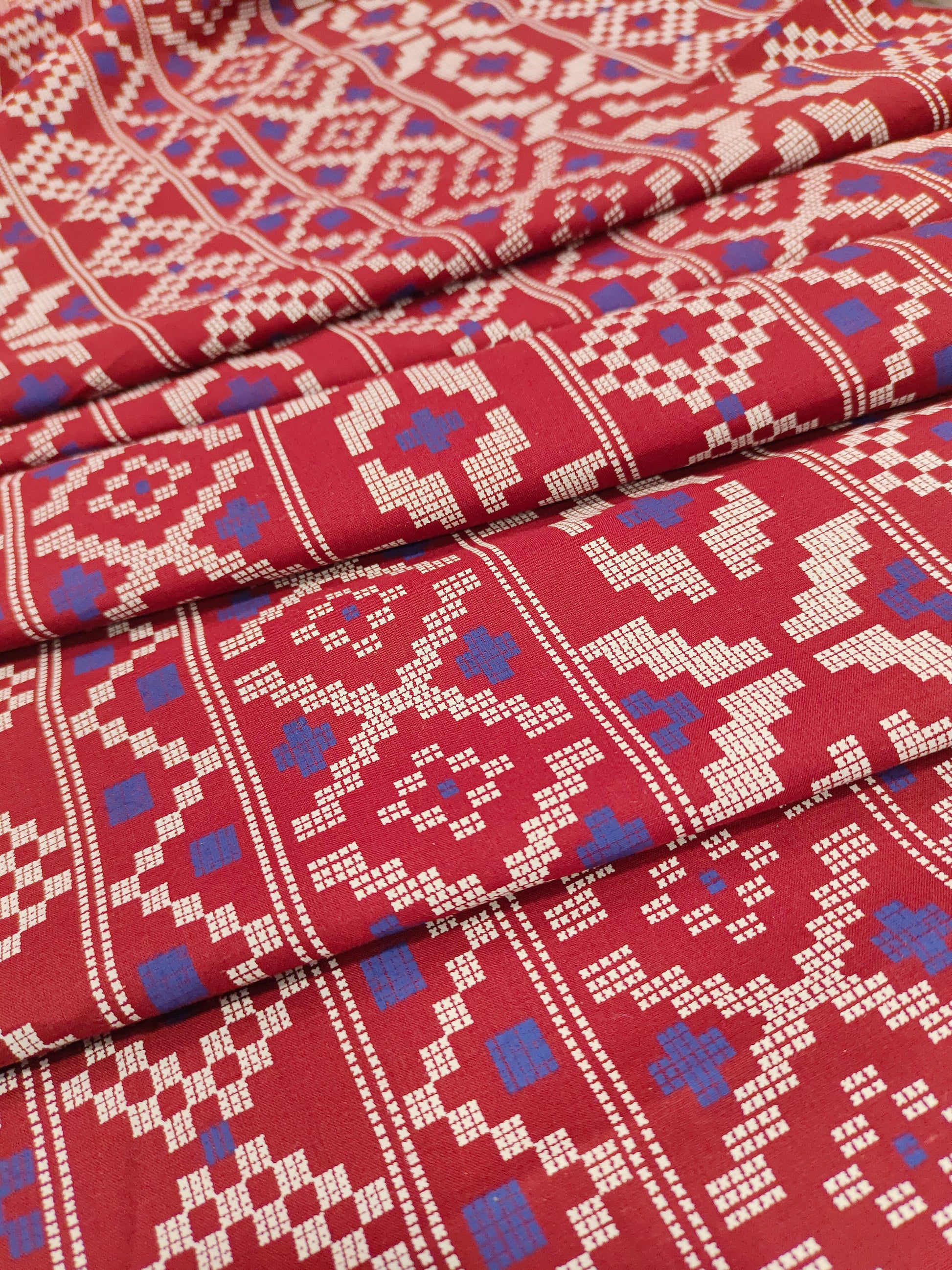 Maroon cotton fabric with blue and off white print