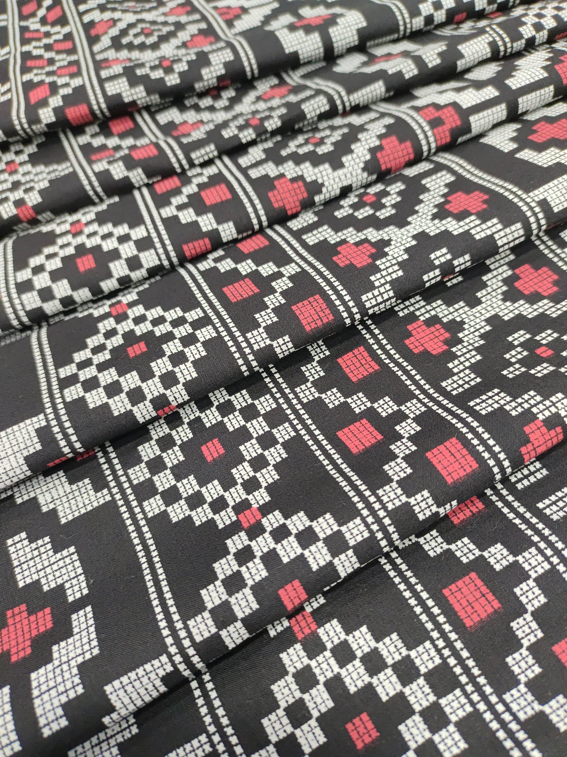 Black cotton fabric with off white and maroon print