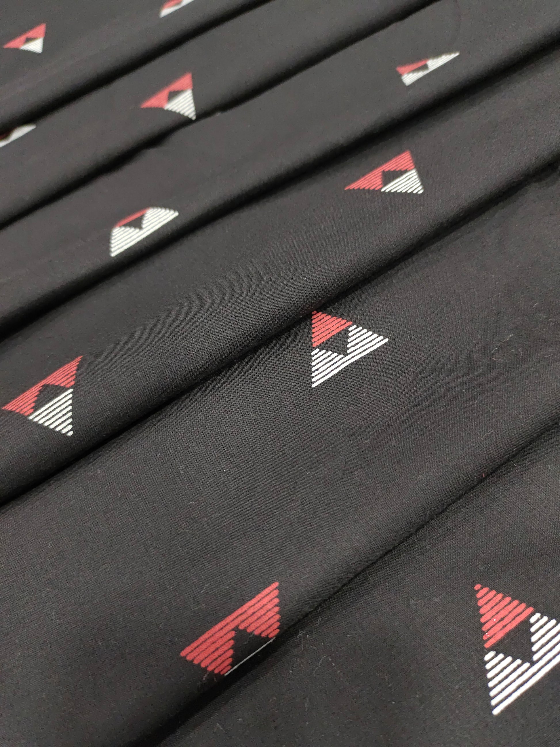 Black cotton fabric triangle print with off white and maroon