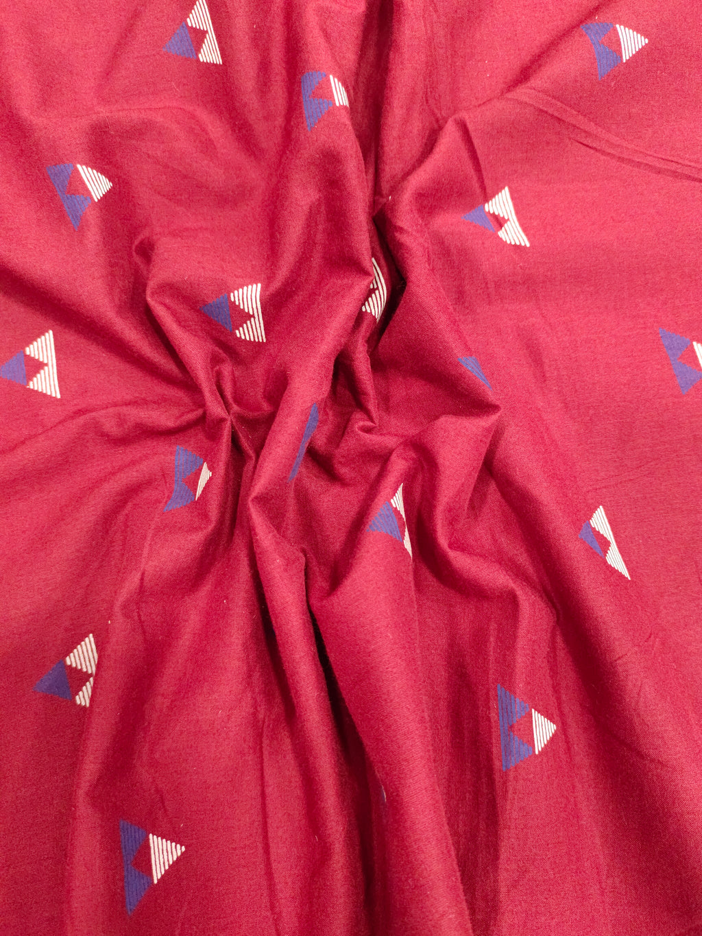 Maroon cotton fabric triangle print with off white and blue