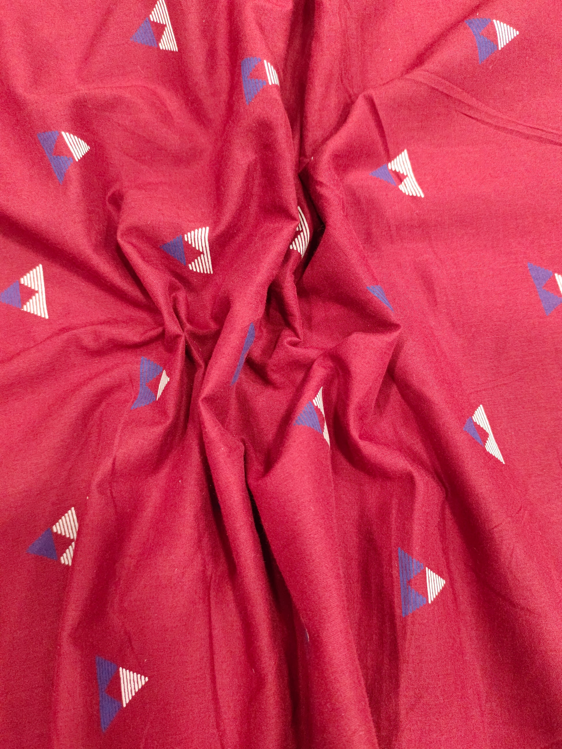 Maroon cotton fabric triangle print with off white and blue
