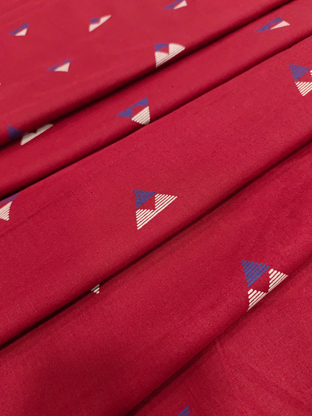 Maroon cotton fabric triangle print with off white and blue