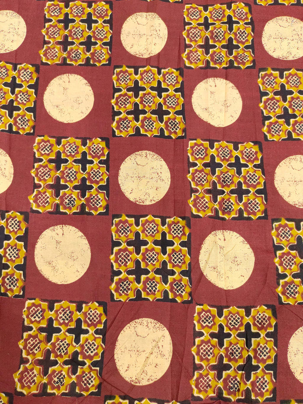 Cotton screen print maroon fabric with yellow white and black