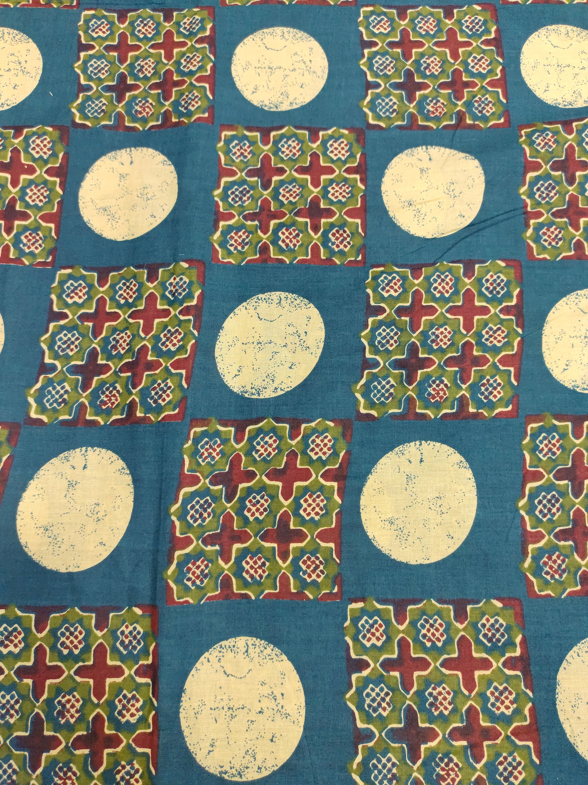 Cotton screen print blue fabric with maroon green and off white