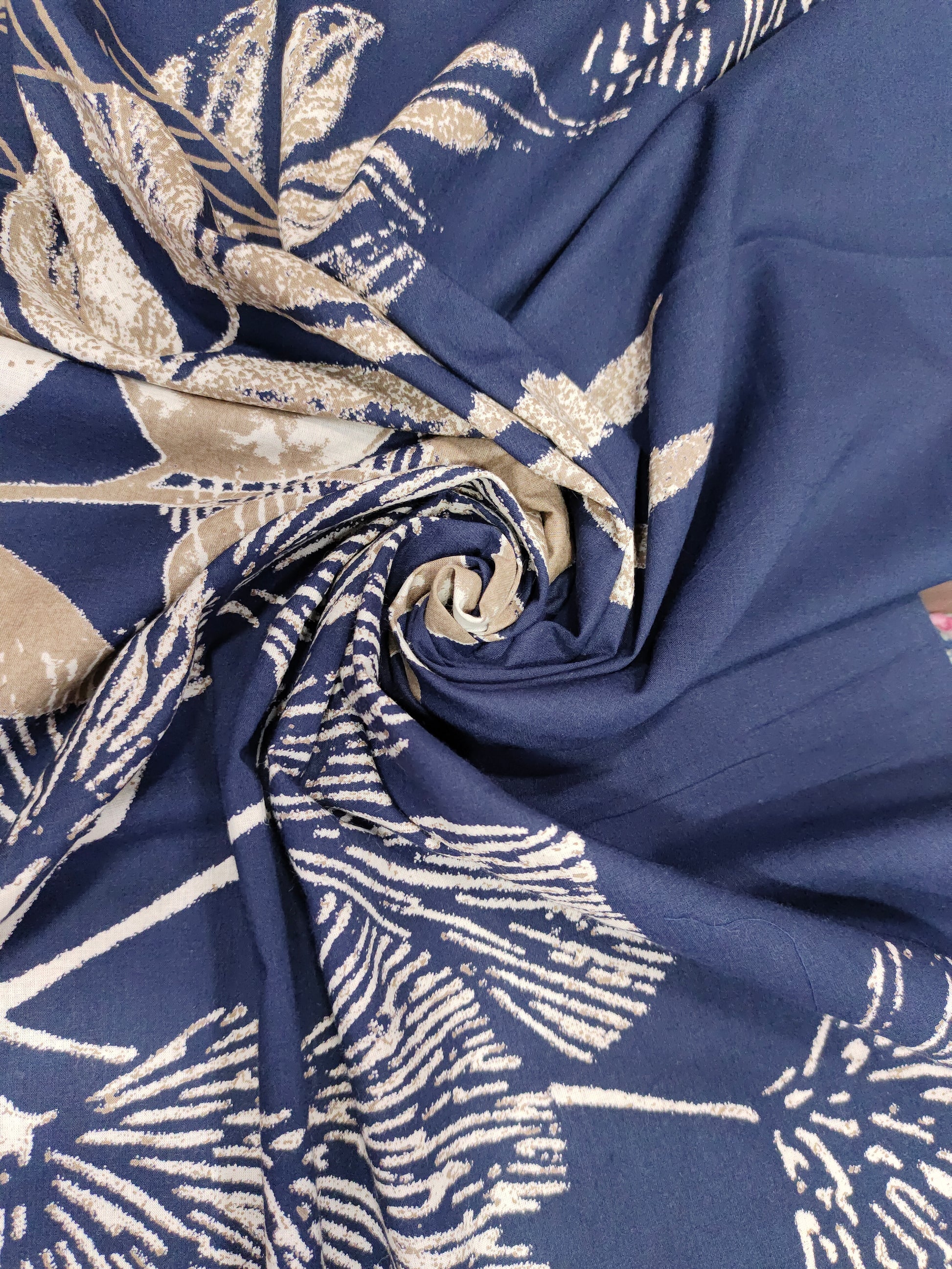 Cotton daman screen print blue fabric with beige floral print.