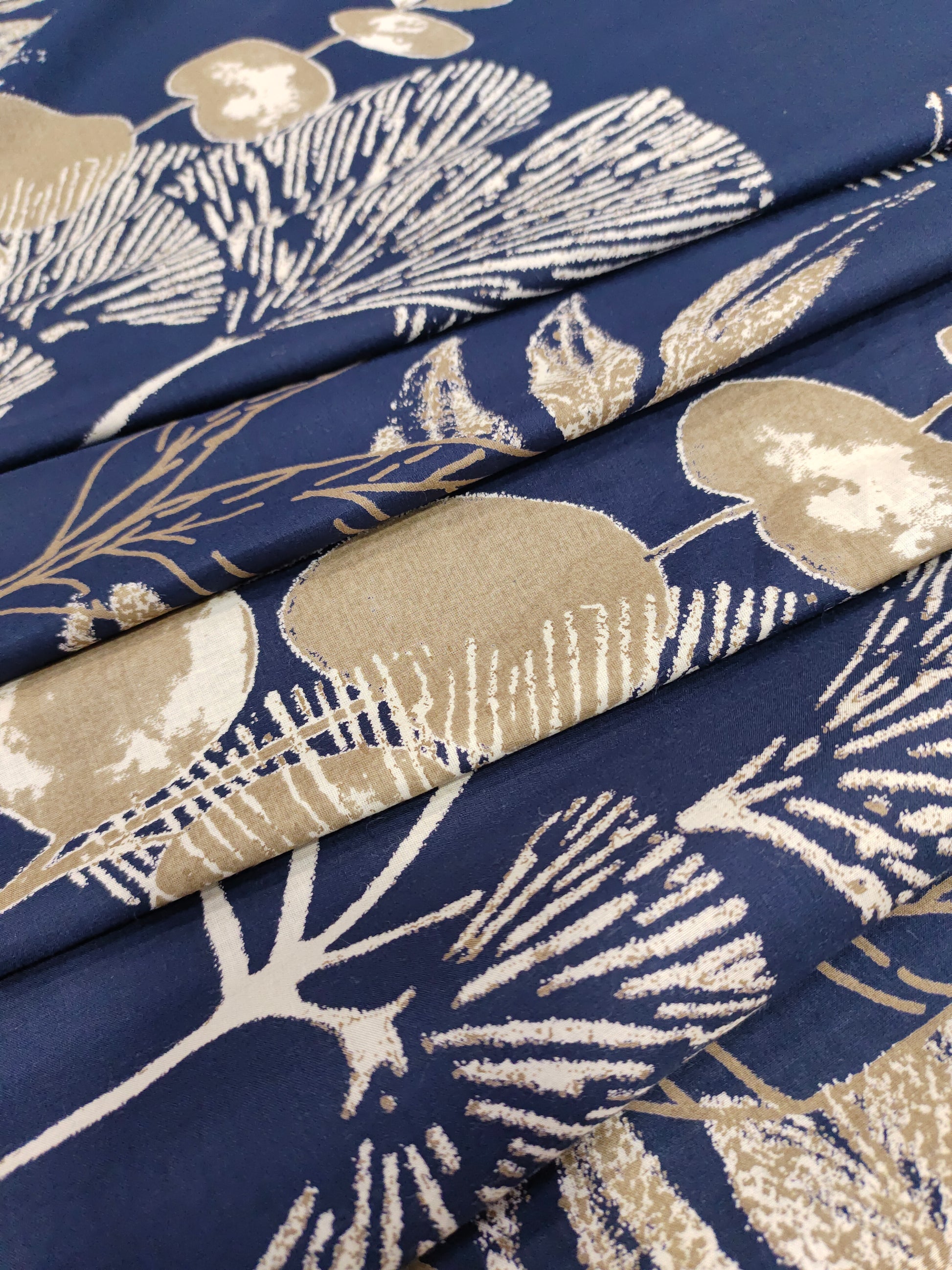 Cotton daman screen print blue fabric with beige floral print.
