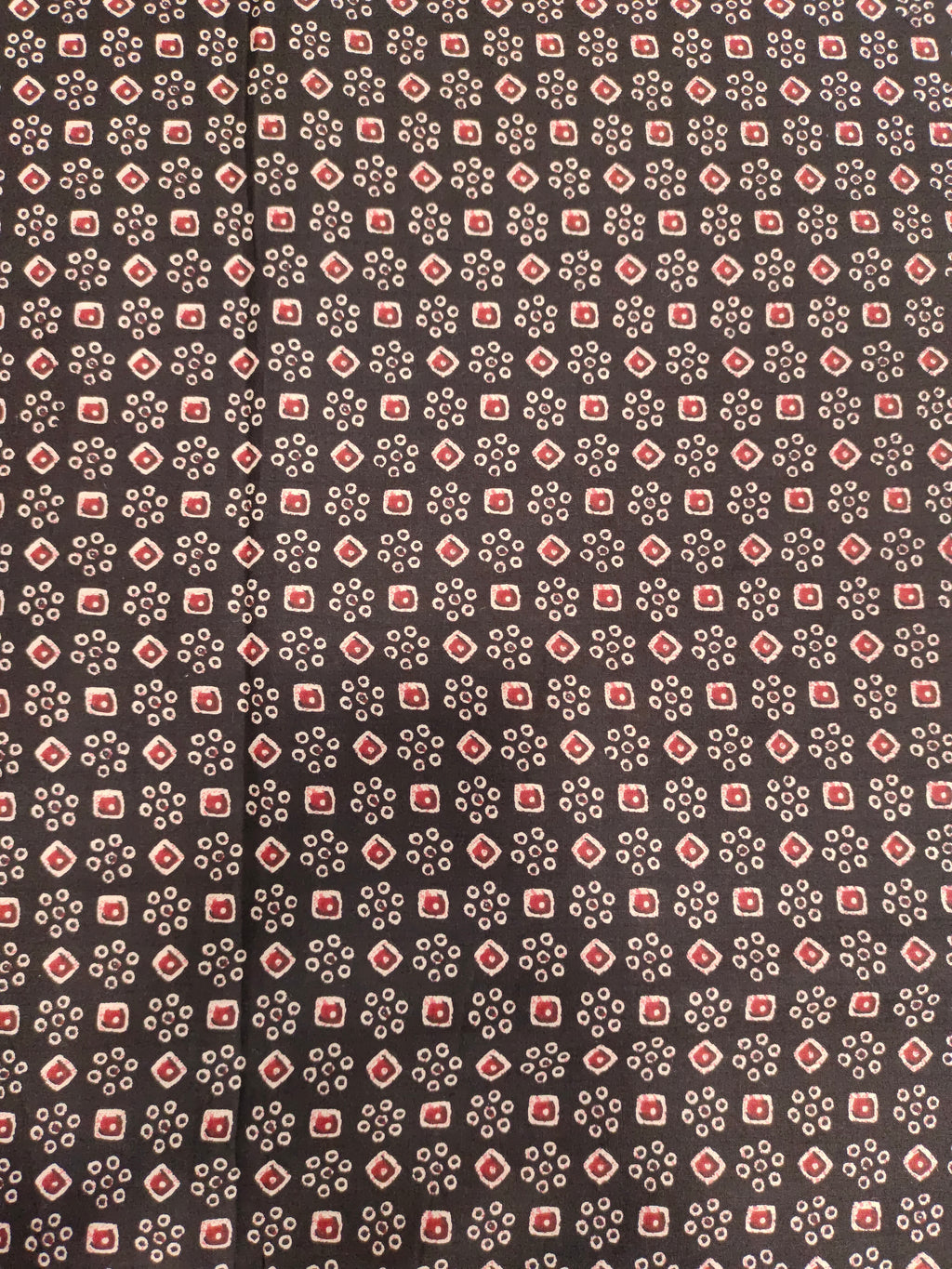 Black fabric with maroon and beige print