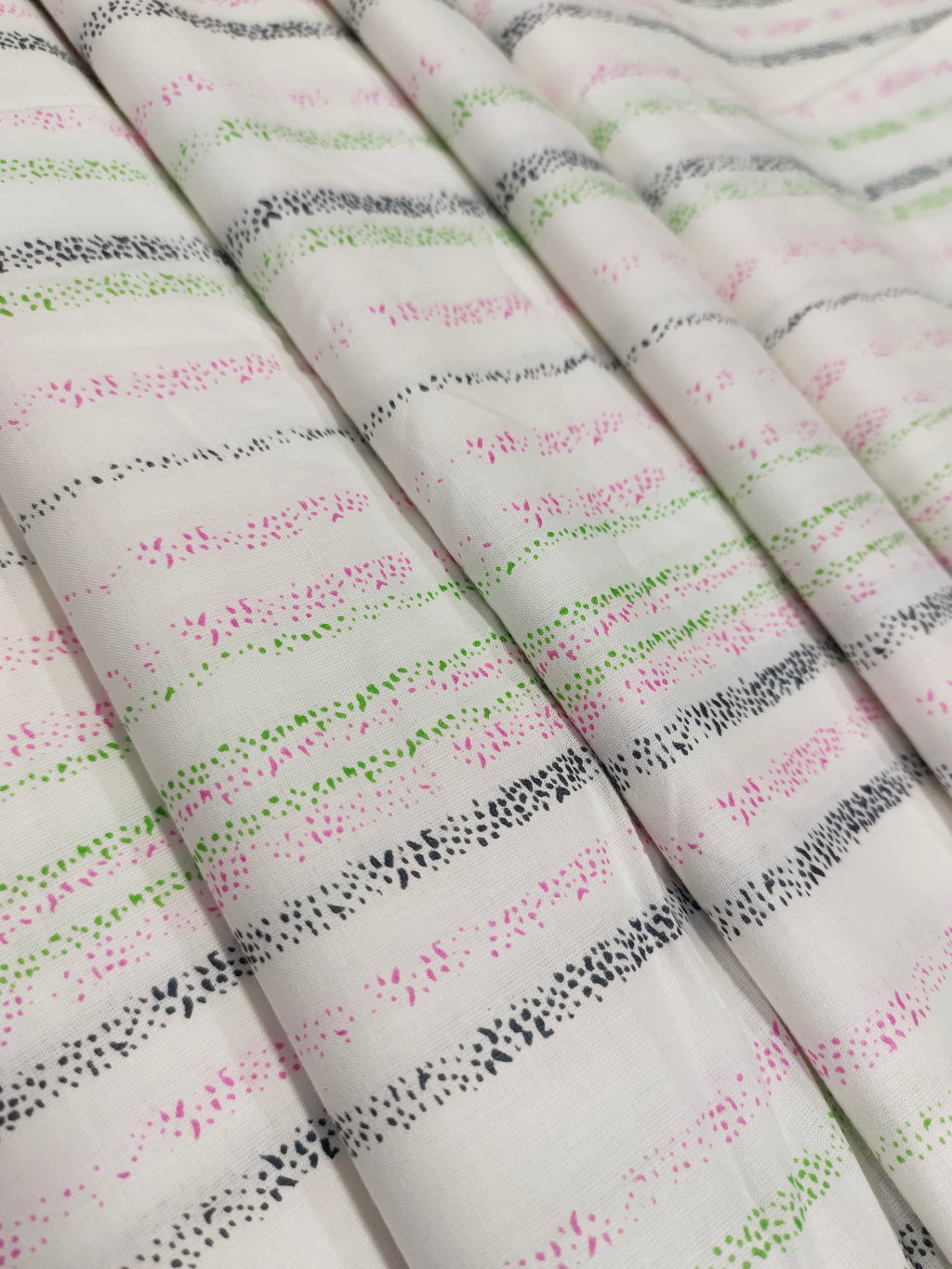 White cotton stripes with pink black green hand block print.